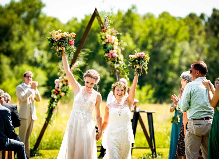 Two brides walk down the aisle