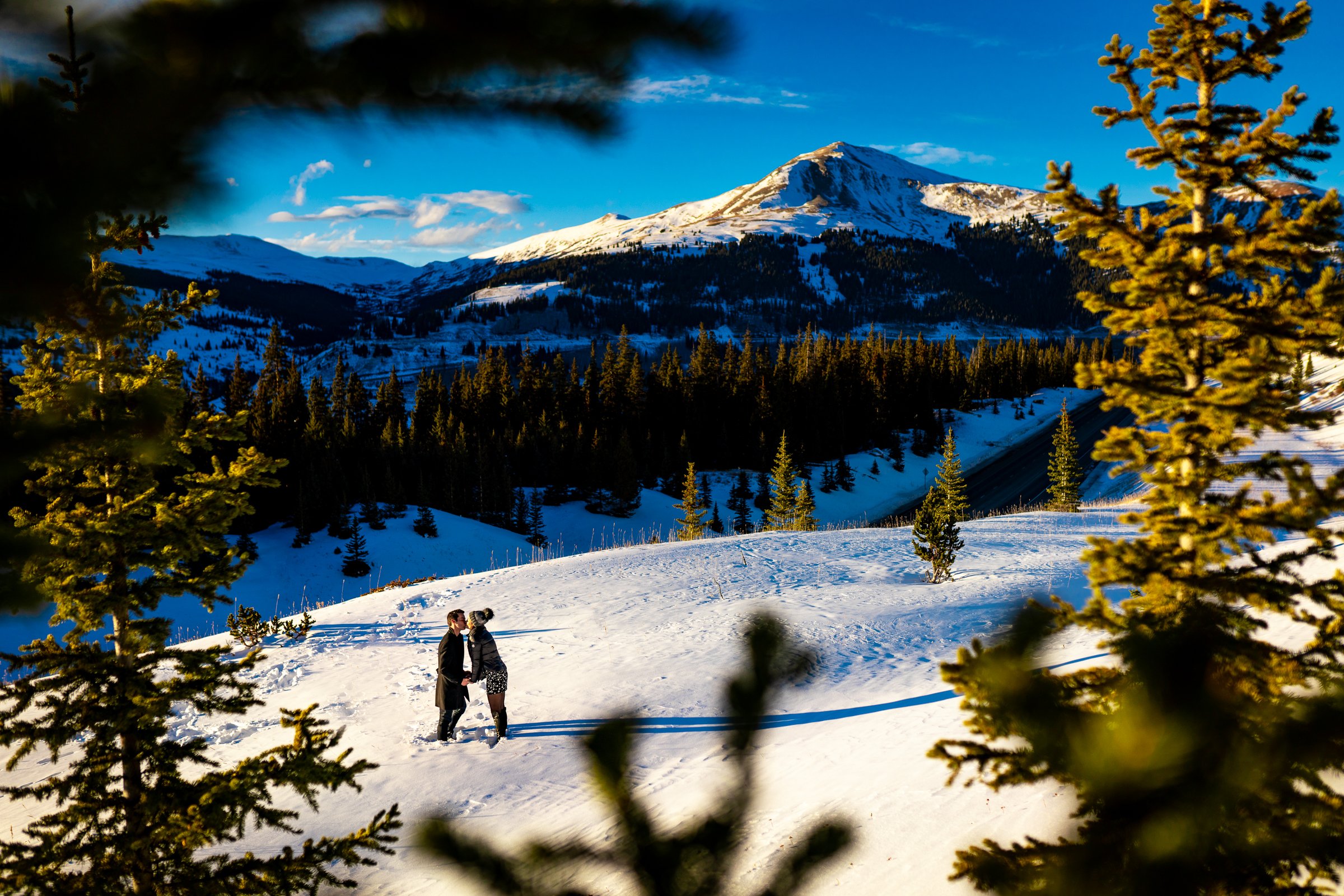 Newly engaged couple celebrate their proposal on a frozen lake with snowcapped mountains in the background, Winter Engagement Session, Winter Engagement Photos, Engagement Photos Inspiration, Engagement Photography, Engagement Photographer, Winter Engagement Photos, Proposal Photos, Proposal Photographer, Proposal Photography, Winter Proposal, Mountain Proposal, Proposal Inspiration, Summit County engagement session, Summit County engagement photos, Summit County engagement photography, Summit County engagement photographer, Summit County engagement inspiration, Colorado engagement session, Colorado engagement photos, Colorado engagement photography, Colorado engagement photographer, Colorado engagement inspiration, Clinton Gulch Engagement