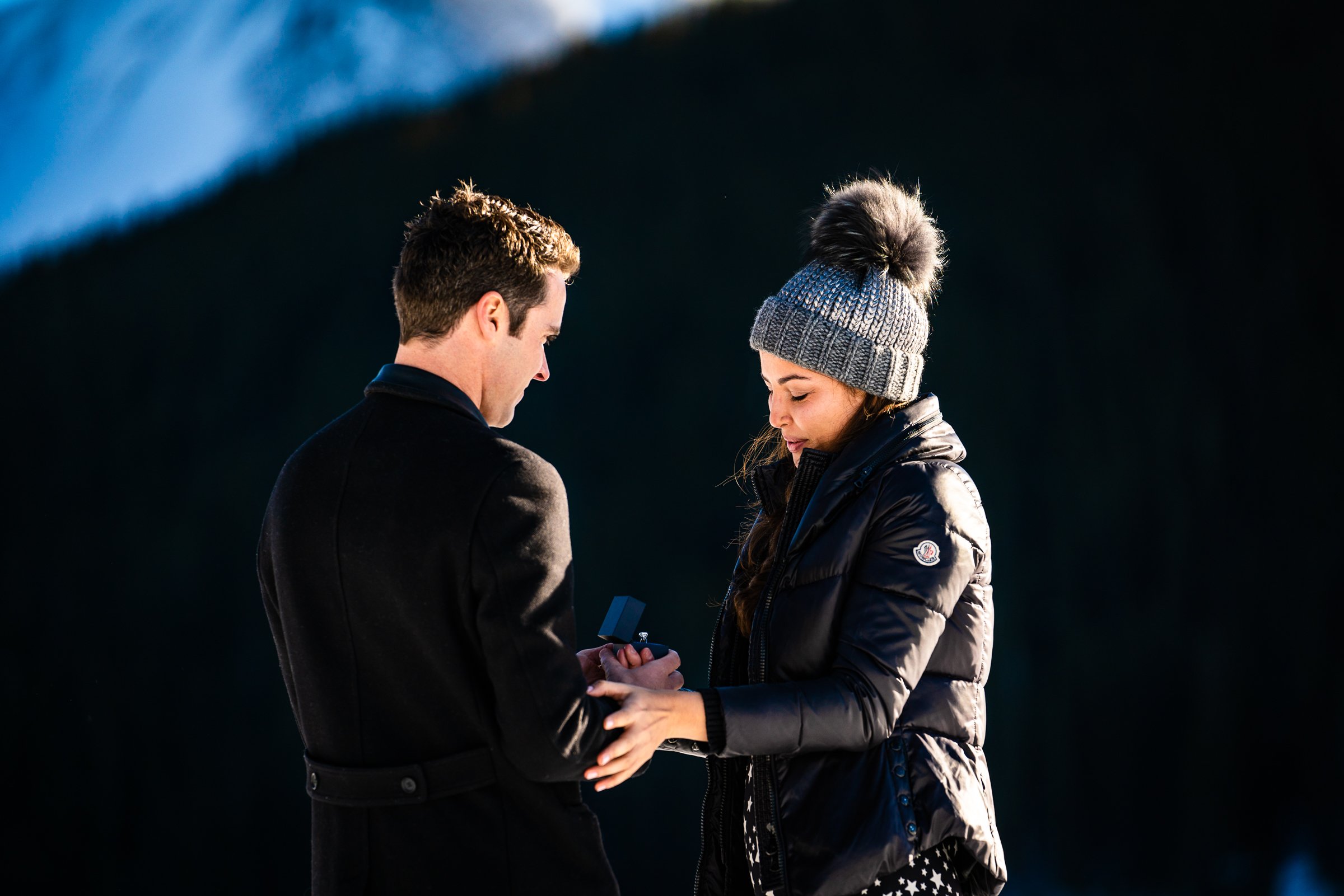 Man proposes to girlfriend while standing on a frozen lake with snowcapped mountains in the background, Engagement Session, Engagement Photos, Engagement Photos Inspiration, Engagement Photography, Engagement Photographer, Winter Engagement Photos, Proposal Photos, Proposal Photographer, Proposal Photography, Winter Proposal, Mountain Proposal, Proposal Inspiration, Summit County engagement session, Summit County engagement photos, Summit County engagement photography, Summit County engagement photographer, Summit County engagement inspiration, Colorado engagement session, Colorado engagement photos, Colorado engagement photography, Colorado engagement photographer, Colorado engagement inspiration, Clinton Gulch Engagement