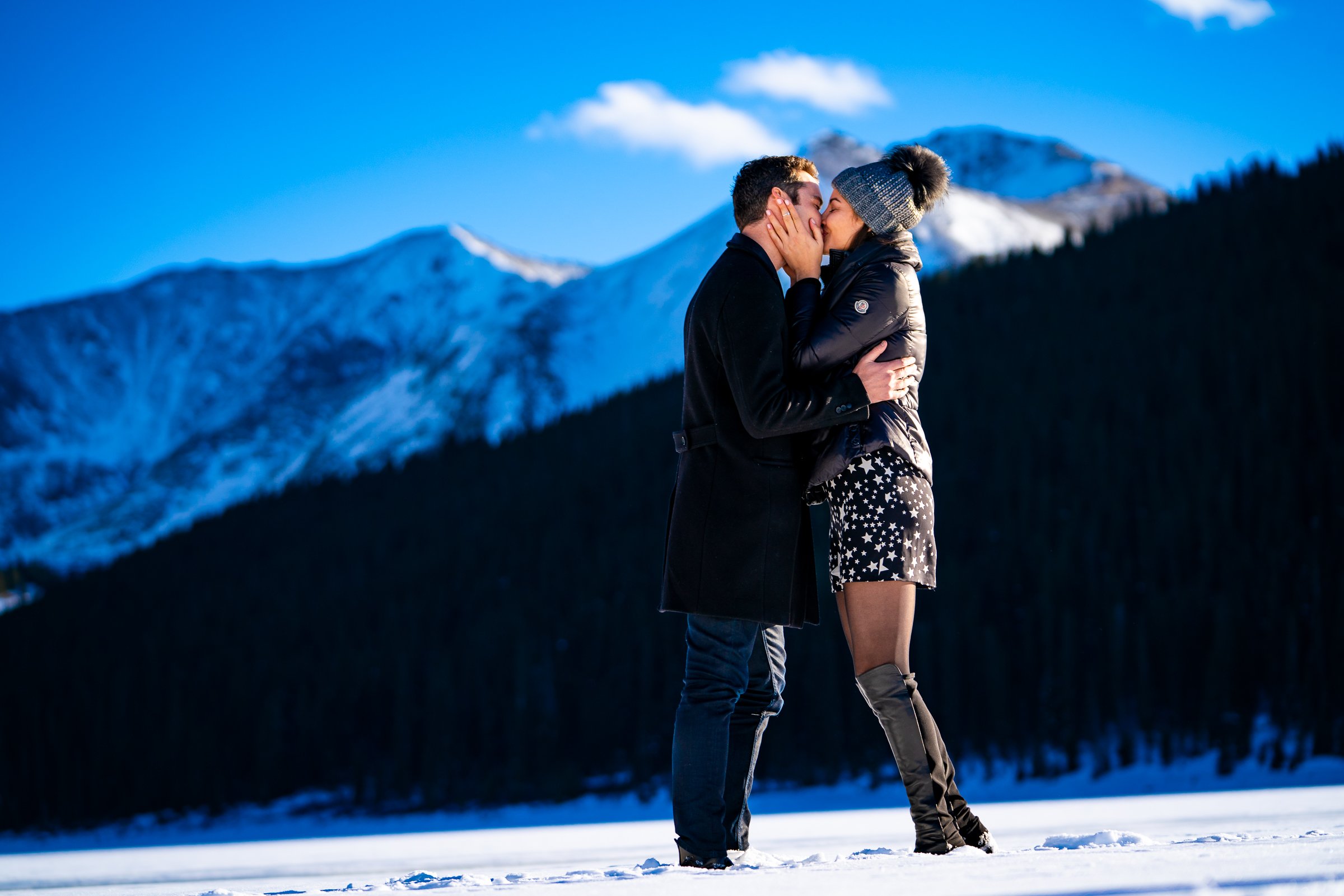 Man proposes to girlfriend while standing on a frozen lake with snowcapped mountains in the background, Engagement Session, Engagement Photos, Engagement Photos Inspiration, Engagement Photography, Engagement Photographer, Winter Engagement Photos, Proposal Photos, Proposal Photographer, Proposal Photography, Winter Proposal, Mountain Proposal, Proposal Inspiration, Summit County engagement session, Summit County engagement photos, Summit County engagement photography, Summit County engagement photographer, Summit County engagement inspiration, Colorado engagement session, Colorado engagement photos, Colorado engagement photography, Colorado engagement photographer, Colorado engagement inspiration, Clinton Gulch Engagement