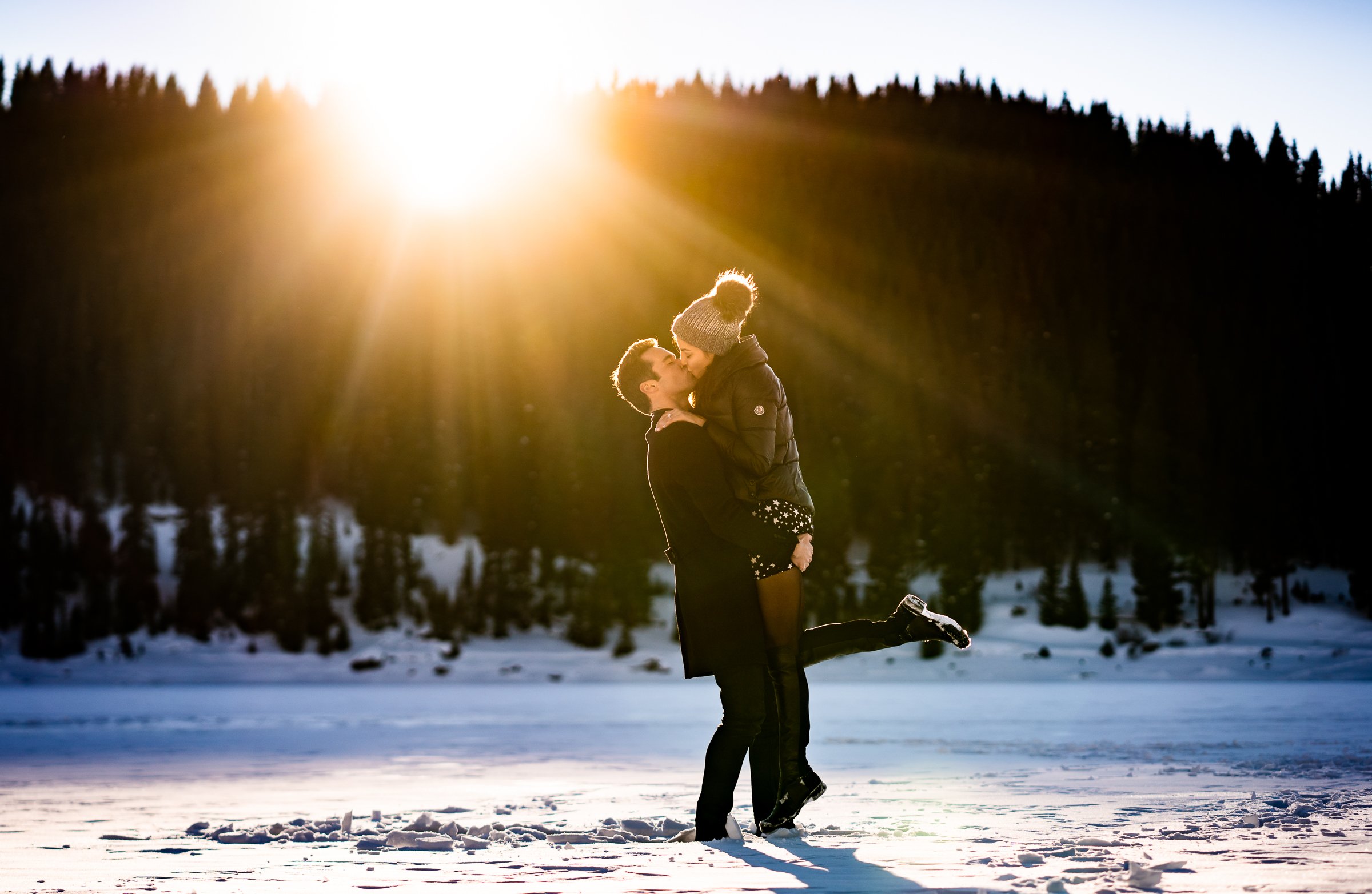 Newly engaged couple celebrate their proposal on a frozen lake with snowcapped mountains in the background, Winter Engagement Session, Winter Engagement Photos, Engagement Photos Inspiration, Engagement Photography, Engagement Photographer, Winter Engagement Photos, Proposal Photos, Proposal Photographer, Proposal Photography, Winter Proposal, Mountain Proposal, Proposal Inspiration, Summit County engagement session, Summit County engagement photos, Summit County engagement photography, Summit County engagement photographer, Summit County engagement inspiration, Colorado engagement session, Colorado engagement photos, Colorado engagement photography, Colorado engagement photographer, Colorado engagement inspiration, Clinton Gulch Engagement