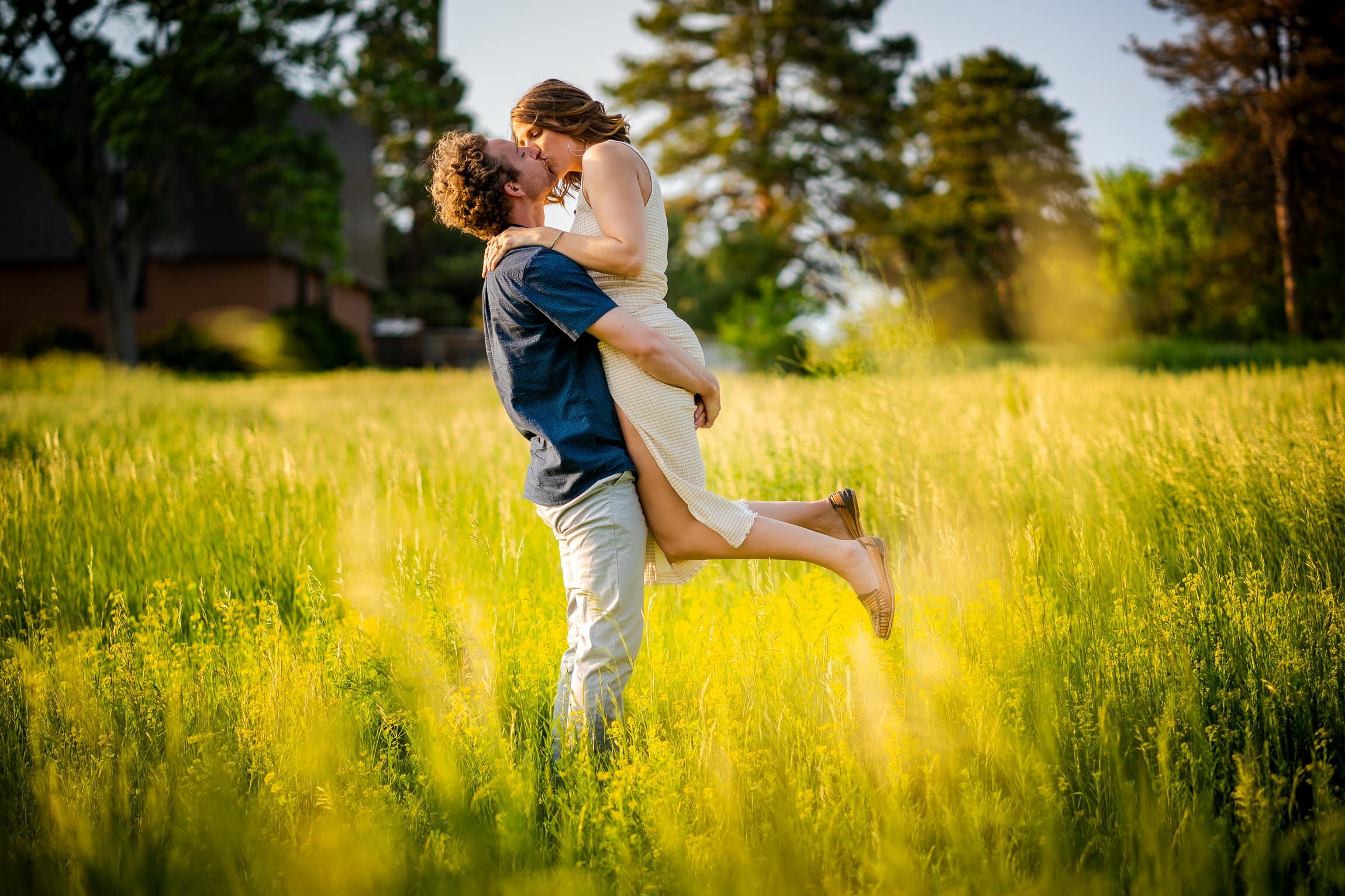 Engaged couple walks while holding hands in the tall windswept grass during golden hour, Engagement Session, Engagement Photos, Engagement Photos Inspiration, Engagement Photography, Engagement Photographer, Winter Engagement Photos, Mountain Engagement Photos, Denver engagement session, Denver engagement photos, Denver engagement photography, Denver engagement photographer, Denver engagement inspiration, Colorado engagement session, Colorado engagement photos, Colorado engagement photography, Colorado engagement photographer, Colorado engagement inspiration