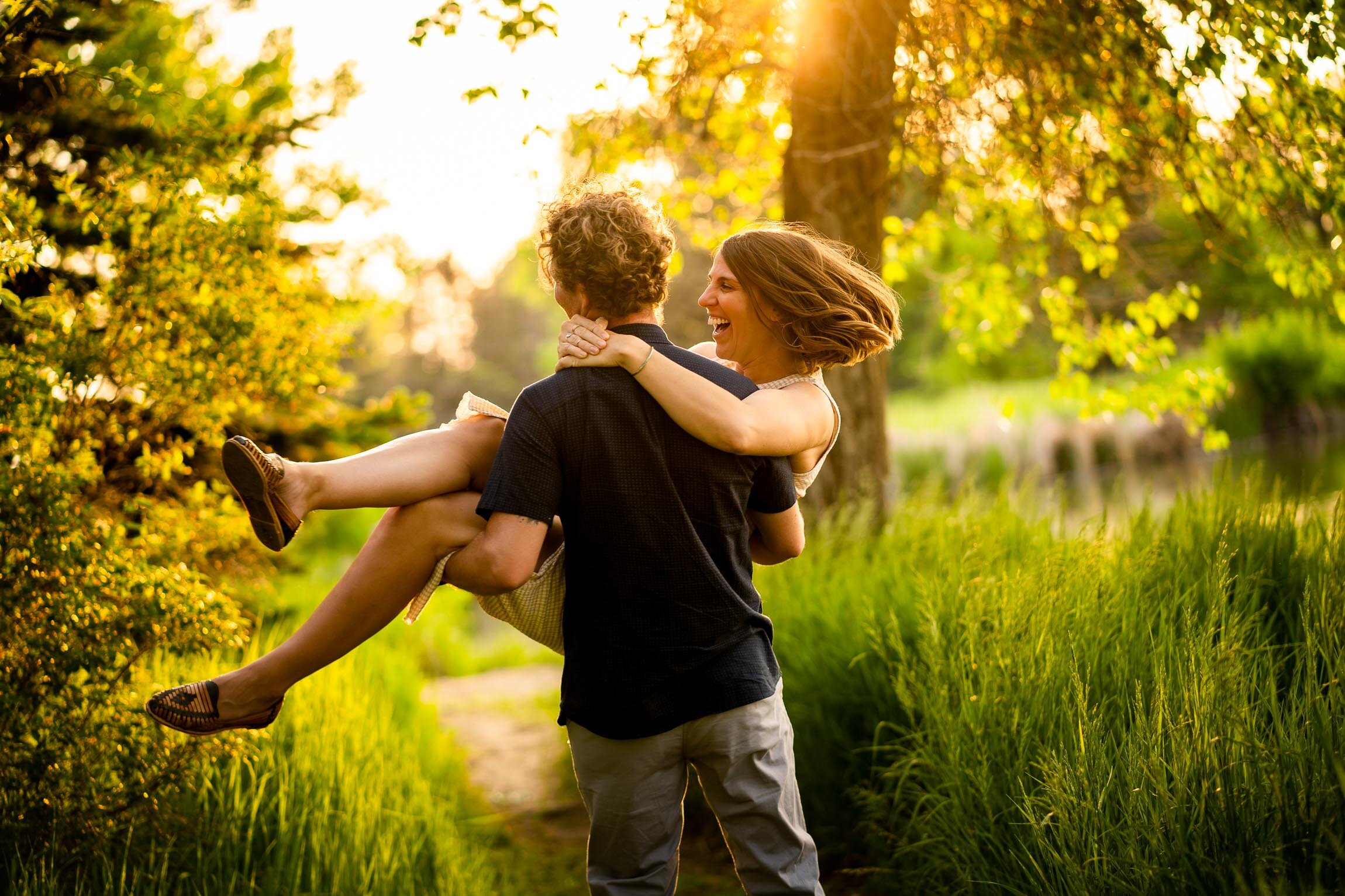 Engaged couple walks while holding hands in the tall windswept grass during golden hour, Engagement Session, Engagement Photos, Engagement Photos Inspiration, Engagement Photography, Engagement Photographer, Winter Engagement Photos, Mountain Engagement Photos, Denver engagement session, Denver engagement photos, Denver engagement photography, Denver engagement photographer, Denver engagement inspiration, Colorado engagement session, Colorado engagement photos, Colorado engagement photography, Colorado engagement photographer, Colorado engagement inspiration