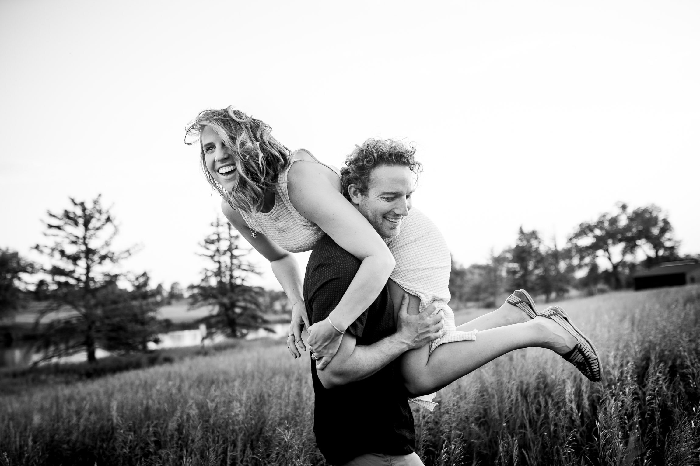 Engaged couple embraces in a field  during golden hour, Engagement Session, Engagement Photos, Engagement Photos Inspiration, Engagement Photography, Engagement Photographer, Winter Engagement Photos, Mountain Engagement Photos, Denver engagement session, Denver engagement photos, Denver engagement photography, Denver engagement photographer, Denver engagement inspiration, Colorado engagement session, Colorado engagement photos, Colorado engagement photography, Colorado engagement photographer, Colorado engagement inspiration