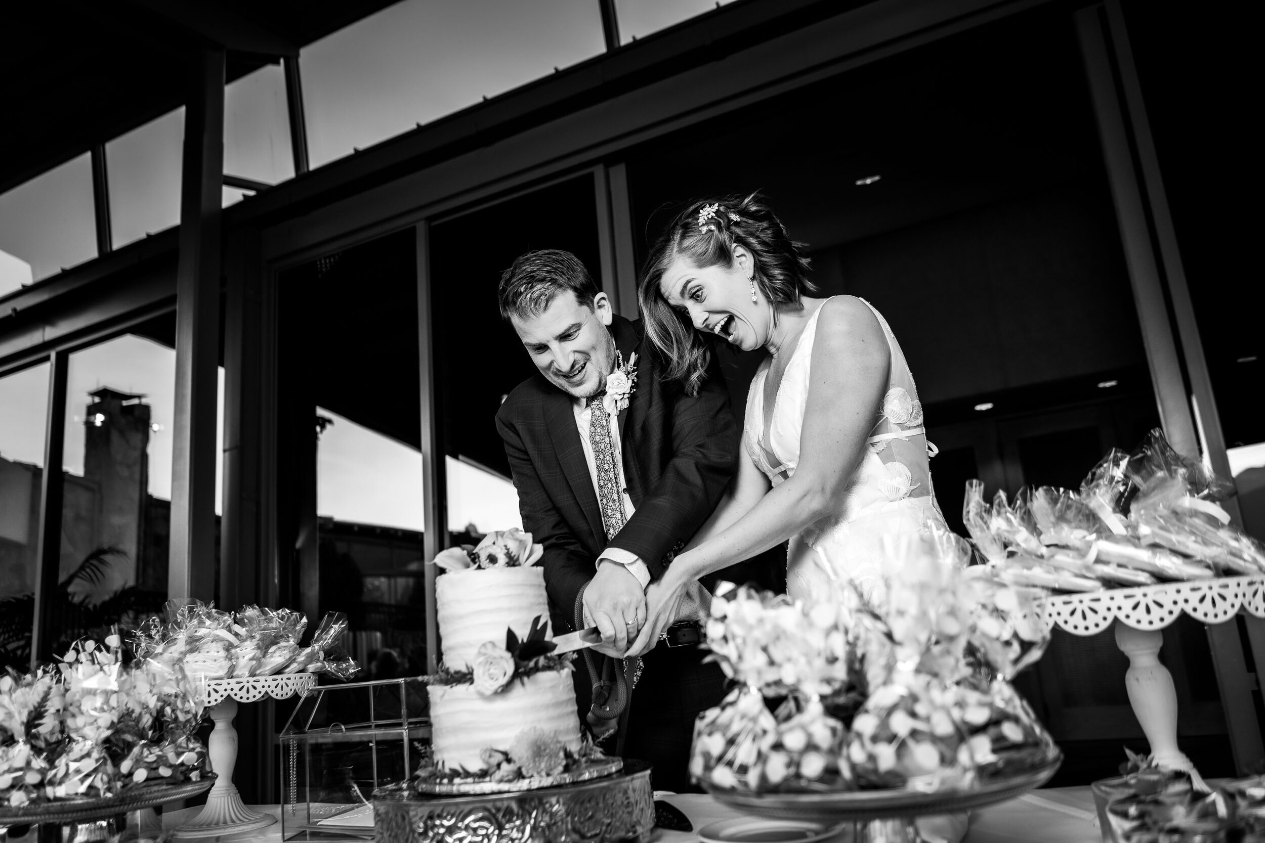 Bride and groom cut their wedding cake at the Garden of the Gods Club and resort by the reflection pond, wedding photos, wedding photography, wedding photographer, wedding inspiration, wedding photo inspiration, wedding portraits, wedding ceremony, wedding reception, mountain wedding, Garden of the Gods wedding, Garden of the Gods Club & Resort wedding, Garden of the Gods Club & Resort wedding photos, Garden of the Gods Club & Resort wedding photography, Garden of the Gods Club & Resort wedding photographer, Garden of the Gods Club & Resort wedding inspiration, Garden of the Gods Club & Resort wedding venue, Colorado Springs wedding, Colorado Springs wedding photos,  Colorado Springs wedding photography, Colorado Springs wedding photographer, Colorado wedding, Colorado wedding photos, Colorado wedding photography, Colorado wedding photographer, Colorado mountain wedding, Colorado wedding inspiration