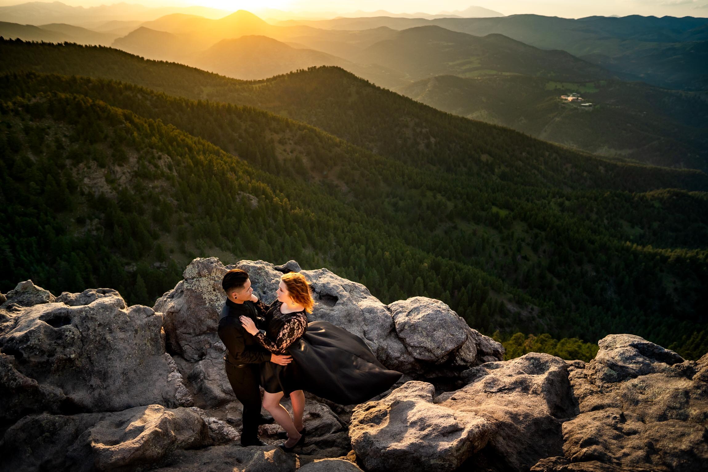 Engaged couple kisses for a portrait on a rocky ledge overlooking the mountains during sunset, Engagement Session, Sunset Engagement photos, Engagement Photos, Engagement Photos Inspiration, Engagement Photography, Engagement Photographer, Summer Engagement Photos, Mountain Engagement Photos, Lost Gulch Overlook engagement session, Lost Gulch Overlook engagement photos, Lost Gulch Overlook engagement photography, Lost Gulch Overlook engagement photographer, Lost Gulch Overlook  engagement inspiration, Boulder engagement session, Boulder engagement photos, Boulder engagement photography, Boulder engagement photographer, Boulder engagement inspiration, Colorado engagement session, Colorado engagement photos, Colorado engagement photography, Colorado engagement photographer, Colorado engagement inspiration