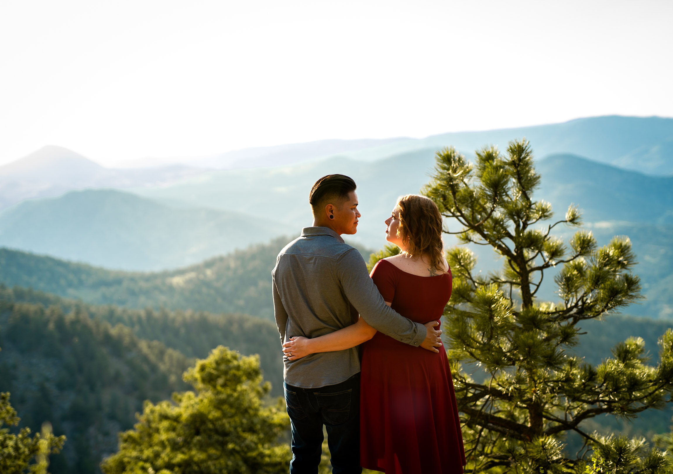 Engaged couple pose for a portrait in front of the rocky mountains during golden hour, Engagement Session, Engagement Photos, Engagement Photos Inspiration, Engagement Photography, Engagement Photographer, Summer Engagement Photos, Mountain Engagement Photos, Lost Gulch Overlook engagement session, Lost Gulch Overlook engagement photos, Lost Gulch Overlook engagement photography, Lost Gulch Overlook engagement photographer, Lost Gulch Overlook  engagement inspiration, Boulder engagement session, Boulder engagement photos, Boulder engagement photography, Boulder engagement photographer, Boulder engagement inspiration, Colorado engagement session, Colorado engagement photos, Colorado engagement photography, Colorado engagement photographer, Colorado engagement inspiration
