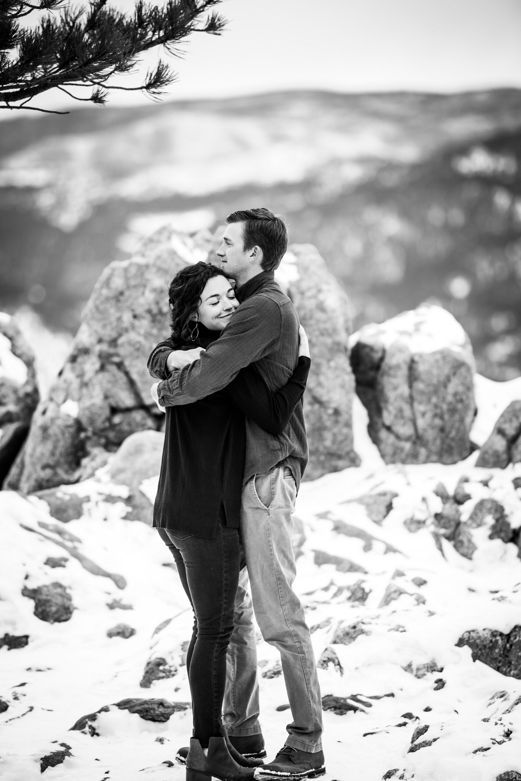 Engaged couple embraces in the snow in a dense evergreen mountain forest, Engagement Session, Engagement Photos, Engagement Photos Inspiration, Engagement Photography, Engagement Photographer, Winter Engagement Photos, Mountain Engagement Photos, Lost Gulch Overlook engagement session, Lost Gulch Overlook engagement photos, Lost Gulch Overlook engagement photography, Lost Gulch Overlook engagement photographer, Lost Gulch Overlook  engagement inspiration, Boulder engagement session, Boulder engagement photos, Boulder engagement photography, Boulder engagement photographer, Boulder engagement inspiration, Colorado engagement session, Colorado engagement photos, Colorado engagement photography, Colorado engagement photographer, Colorado engagement inspiration