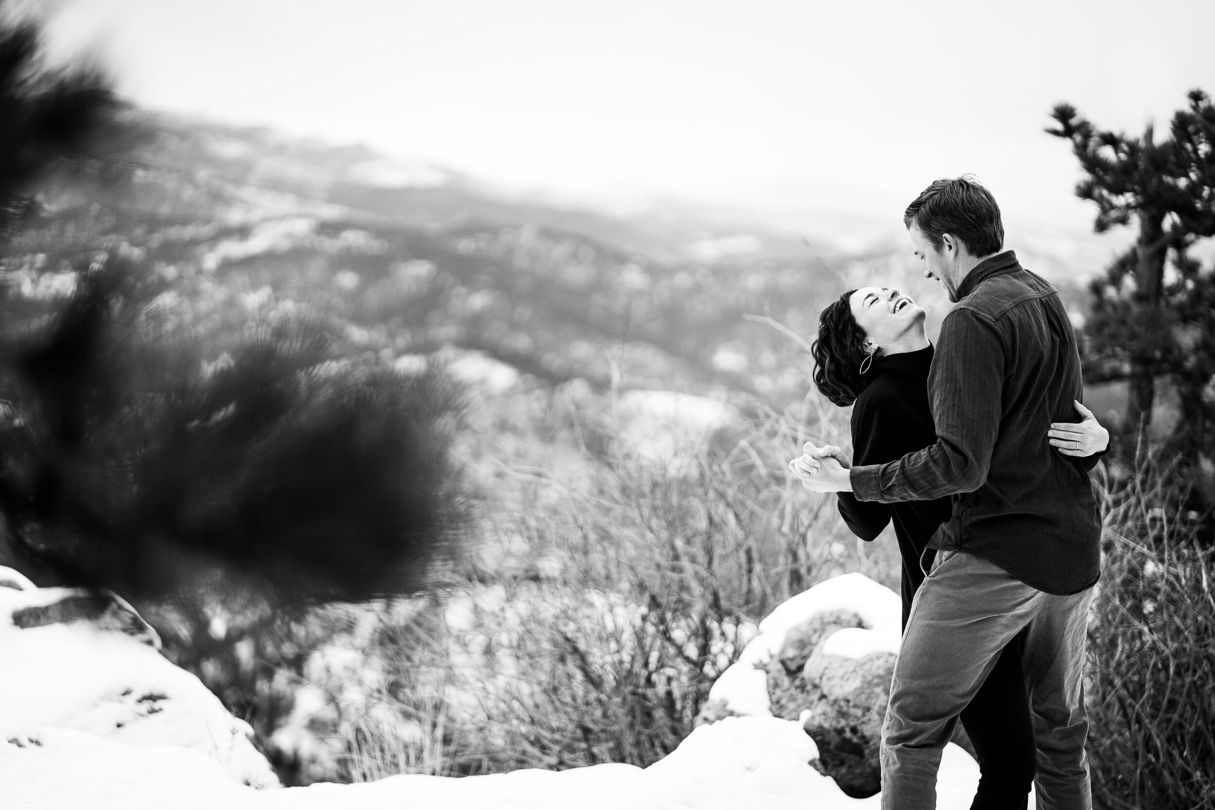 Engaged couple embraces in the snow in a dense evergreen mountain forest, Engagement Session, Engagement Photos, Engagement Photos Inspiration, Engagement Photography, Engagement Photographer, Winter Engagement Photos, Mountain Engagement Photos, Lost Gulch Overlook engagement session, Lost Gulch Overlook engagement photos, Lost Gulch Overlook engagement photography, Lost Gulch Overlook engagement photographer, Lost Gulch Overlook  engagement inspiration, Boulder engagement session, Boulder engagement photos, Boulder engagement photography, Boulder engagement photographer, Boulder engagement inspiration, Colorado engagement session, Colorado engagement photos, Colorado engagement photography, Colorado engagement photographer, Colorado engagement inspiration