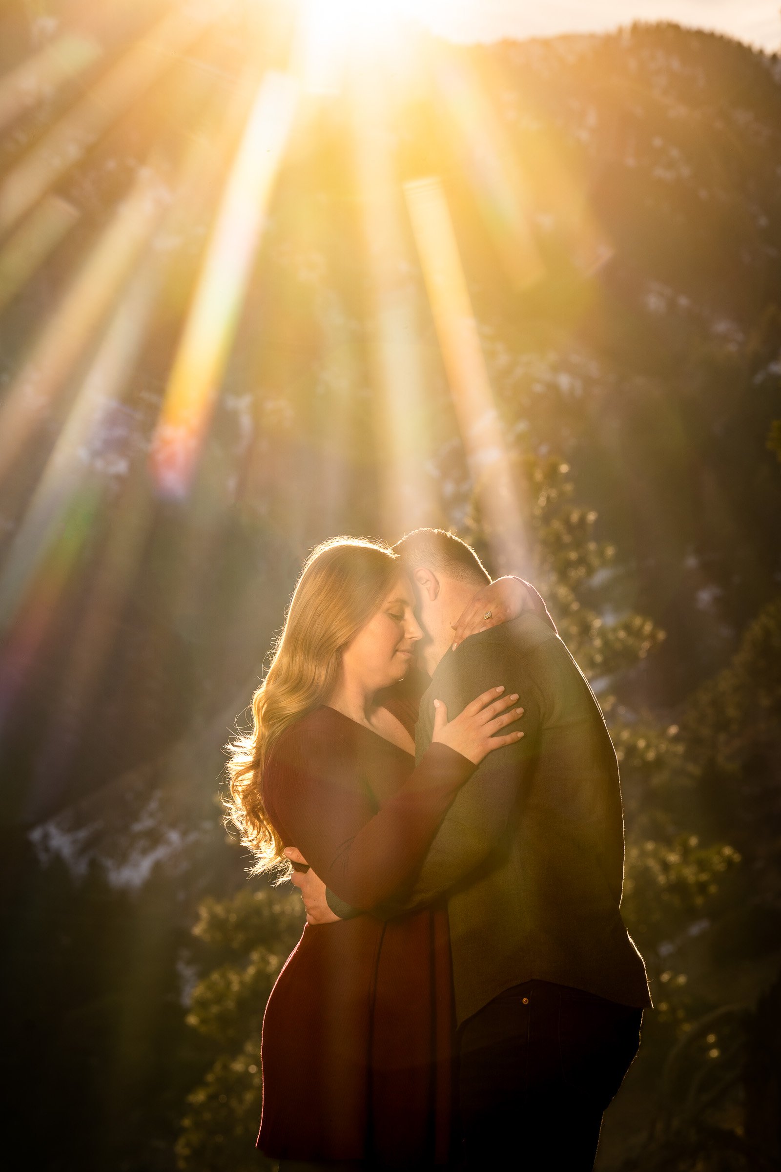 Couple poses for portraits during golden hour with mountains in the background, Mountain Engagement Photos, Engagement Session, Engagement Photos, Engagement Photos Inspiration, Engagement Photography, Engagement Photographer, Engagement Portraits, Winter Engagement Photos, Snow Engagement Photos, Boulder engagement session, Boulder engagement photos, Boulder engagement photography, Boulder engagement photographer, Boulder engagement inspiration, NCAR Trail engagement session, NCAR Trail engagement photos, NCAR Trail engagement photography, NCAR Trail engagement photographer, NCAR Trail engagement inspiration, Colorado engagement session, Colorado engagement photos, Colorado engagement photography, Colorado engagement photographer, Colorado engagement inspiration