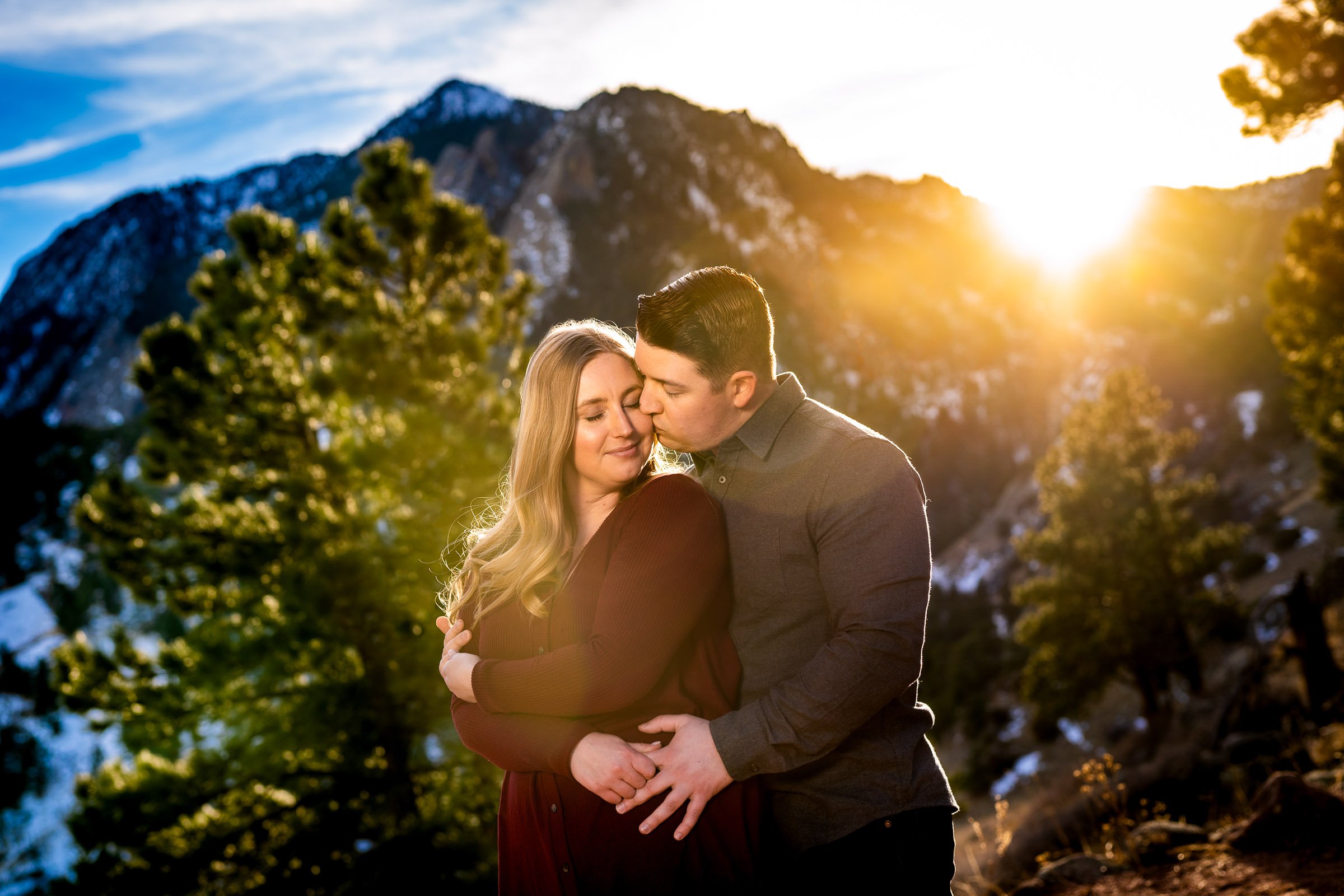 Engaged couple poses for portraits with the flatiron mountains in the background, Mountain Engagement Photos, Engagement Session, Engagement Photos, Engagement Photos Inspiration, Engagement Photography, Engagement Photographer, Engagement Portraits, Winter Engagement Photos, Snow Engagement Photos, Boulder engagement session, Boulder engagement photos, Boulder engagement photography, Boulder engagement photographer, Boulder engagement inspiration, NCAR Trail engagement session, NCAR Trail engagement photos, NCAR Trail engagement photography, NCAR Trail engagement photographer, NCAR Trail engagement inspiration, Colorado engagement session, Colorado engagement photos, Colorado engagement photography, Colorado engagement photographer, Colorado engagement inspiration, Flatiron Engagement Photos, Chautauqua Engagement Photos