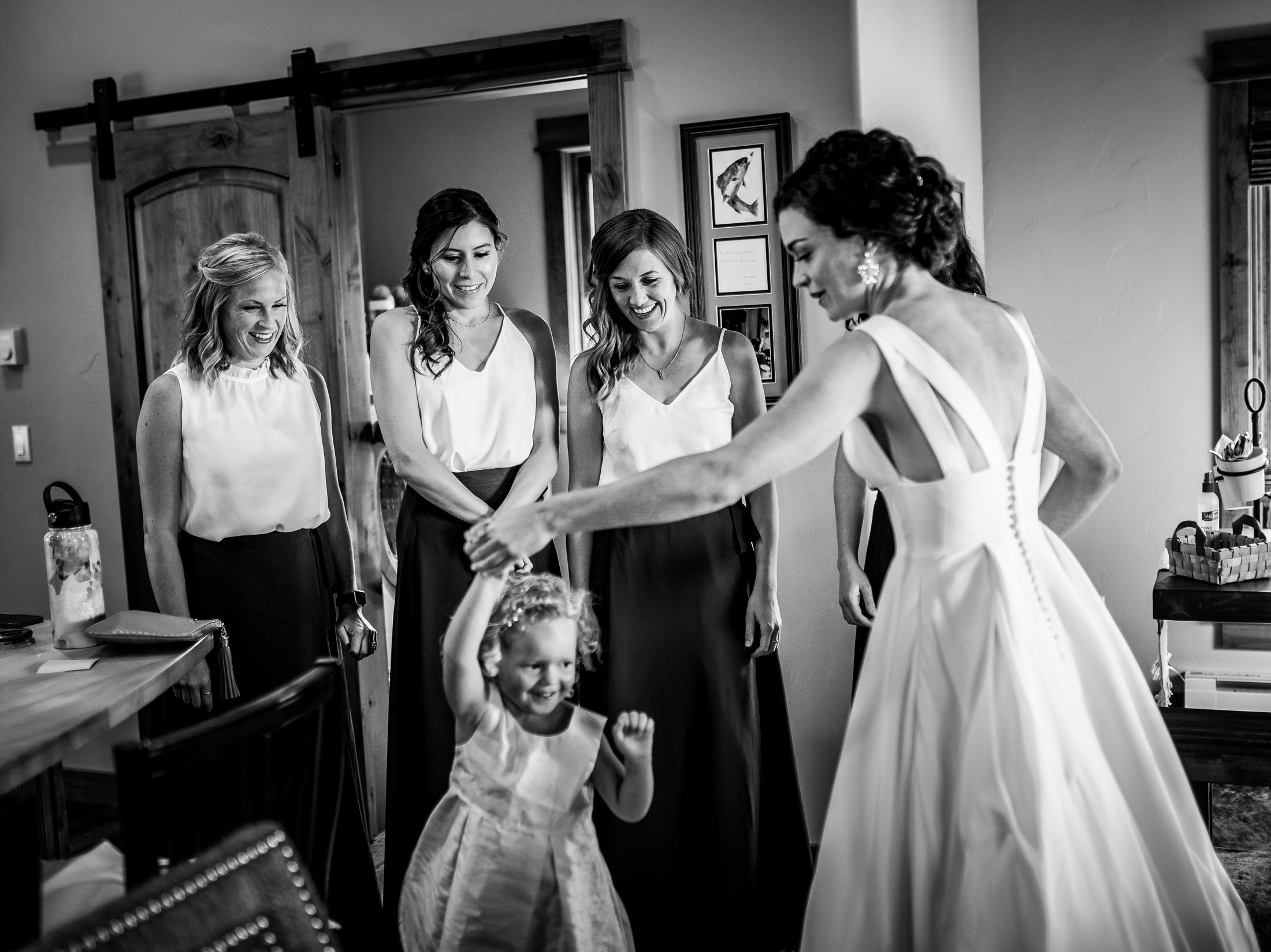 Bride gets into her wedding gown as she plays with her niece at her family's home in the mountains, wedding, wedding photos, wedding photography, wedding photographer, wedding inspiration, wedding photo inspiration, wedding portraits, wedding ceremony, wedding reception, mountain wedding, Catholic Church wedding, Catholic Church wedding photos, Catholic Church wedding photography, Catholic Church wedding photographer, Catholic Church wedding inspiration, Catholic Church wedding venue, Steamboat Springs wedding, Steamboat Springs wedding photos, Steamboat Springs wedding photography, Steamboat Springs wedding photographer, Colorado wedding, Colorado wedding photos, Colorado wedding photography, Colorado wedding photographer, Colorado mountain wedding, Colorado wedding inspiration