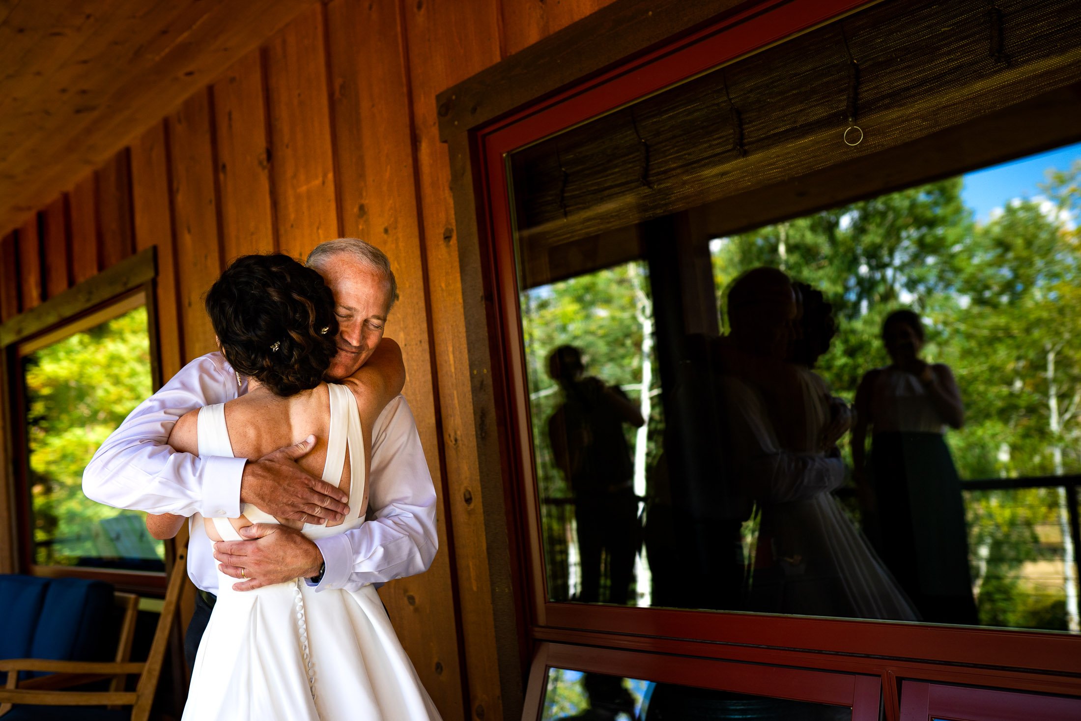 Bride has a first look with her father at her family's home in the mountains, wedding, wedding photos, wedding photography, wedding photographer, wedding inspiration, wedding photo inspiration, wedding portraits, wedding ceremony, wedding reception, mountain wedding, Catholic Church wedding, Catholic Church wedding photos, Catholic Church wedding photography, Catholic Church wedding photographer, Catholic Church wedding inspiration, Catholic Church wedding venue, Steamboat Springs wedding, Steamboat Springs wedding photos, Steamboat Springs wedding photography, Steamboat Springs wedding photographer, Colorado wedding, Colorado wedding photos, Colorado wedding photography, Colorado wedding photographer, Colorado mountain wedding, Colorado wedding inspiration