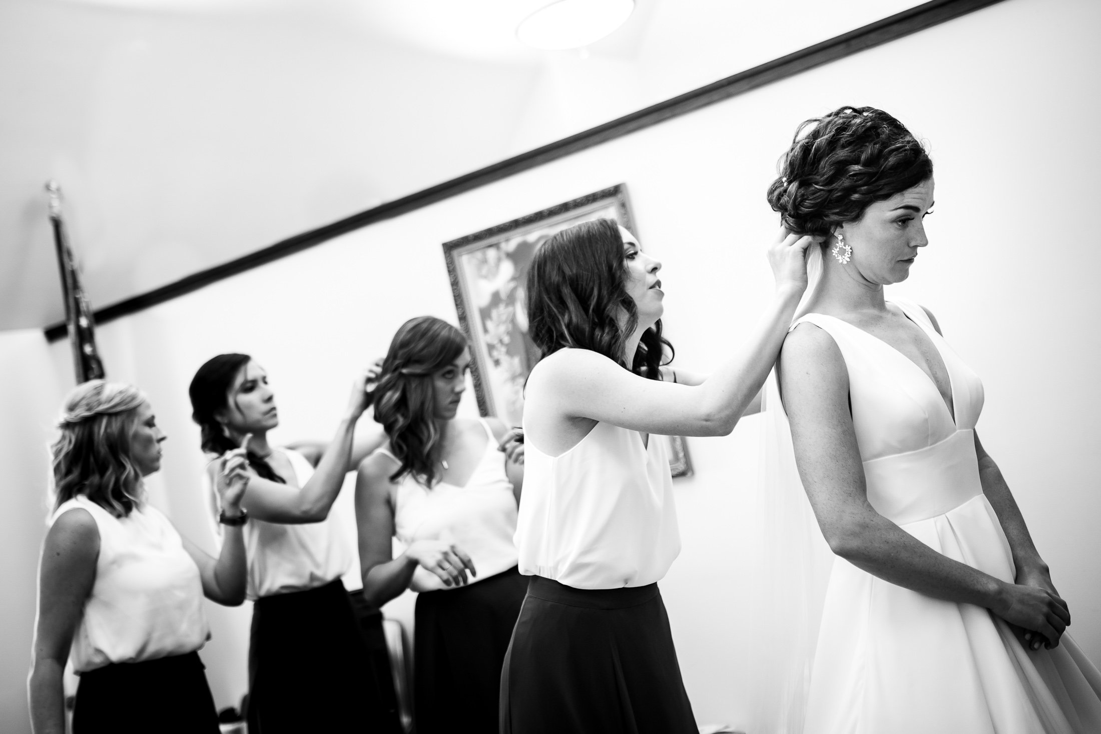 Bride gets ready with the help of her bridesmaids who fix in her veil, wedding, wedding photos, wedding photography, wedding photographer, wedding inspiration, wedding photo inspiration, wedding portraits, wedding ceremony, wedding reception, mountain wedding, Catholic Church wedding, Catholic Church wedding photos, Catholic Church wedding photography, Catholic Church wedding photographer, Catholic Church wedding inspiration, Catholic Church wedding venue, Steamboat Springs wedding, Steamboat Springs wedding photos, Steamboat Springs wedding photography, Steamboat Springs wedding photographer, Colorado wedding, Colorado wedding photos, Colorado wedding photography, Colorado wedding photographer, Colorado mountain wedding, Colorado wedding inspiration