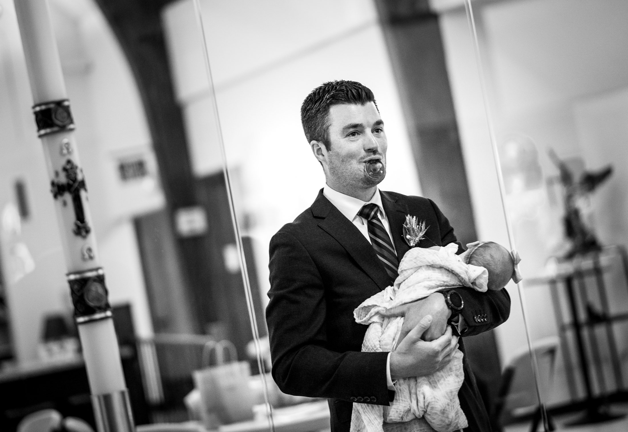 Bride's brother holds his baby during his sister's catholic wedding ceremony at the church, wedding, wedding photos, wedding photography, wedding photographer, wedding inspiration, wedding photo inspiration, wedding portraits, wedding ceremony, wedding reception, mountain wedding, Catholic Church wedding, Catholic Church wedding photos, Catholic Church wedding photography, Catholic Church wedding photographer, Catholic Church wedding inspiration, Catholic Church wedding venue, Steamboat Springs wedding, Steamboat Springs wedding photos, Steamboat Springs wedding photography, Steamboat Springs wedding photographer, Colorado wedding, Colorado wedding photos, Colorado wedding photography, Colorado wedding photographer, Colorado mountain wedding, Colorado wedding inspiration