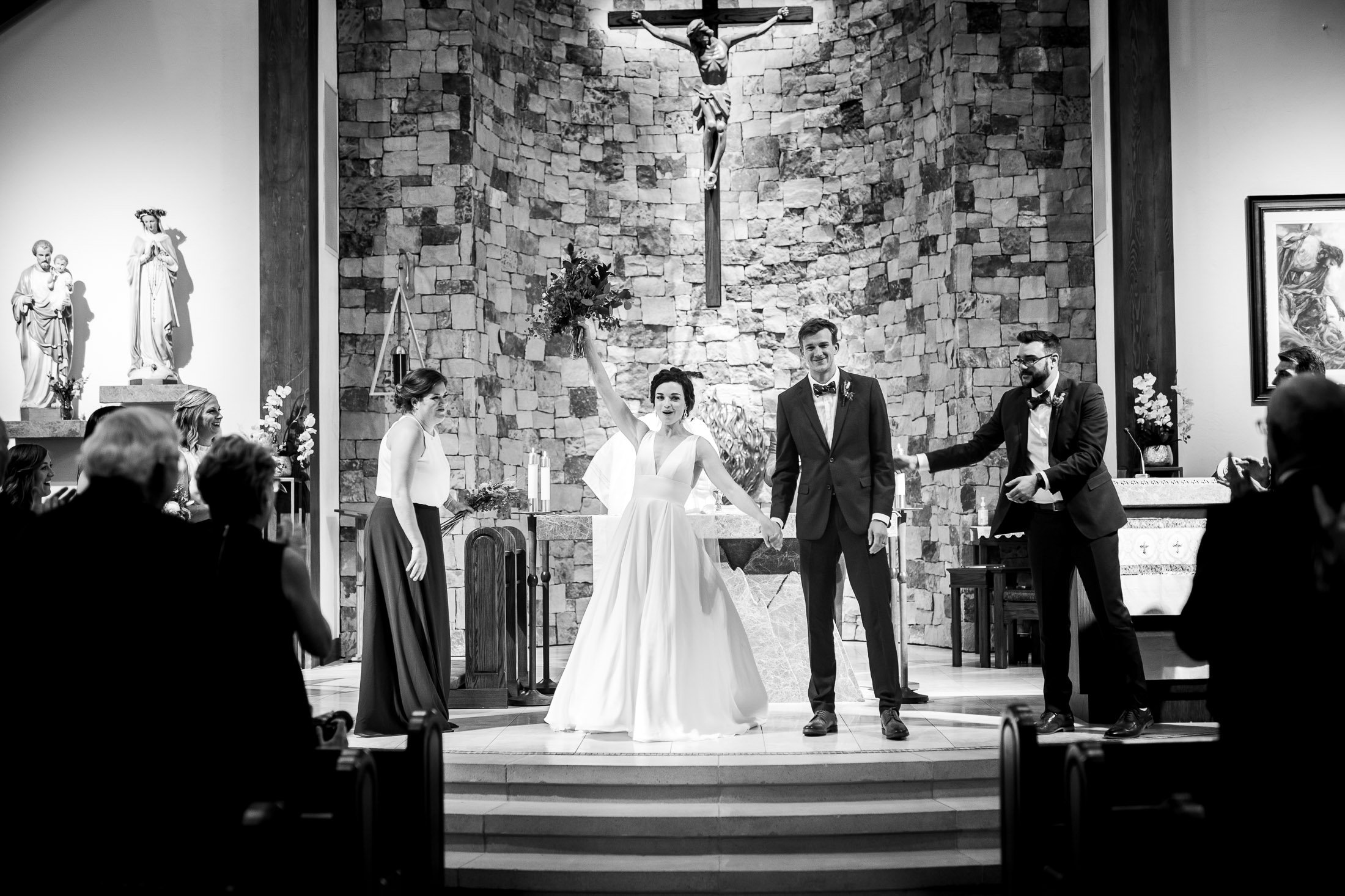 Bride and groom celebrate as newlyweds during their catholic wedding ceremony at the church, wedding, wedding photos, wedding photography, wedding photographer, wedding inspiration, wedding photo inspiration, wedding portraits, wedding ceremony, wedding reception, mountain wedding, Catholic Church wedding, Catholic Church wedding photos, Catholic Church wedding photography, Catholic Church wedding photographer, Catholic Church wedding inspiration, Catholic Church wedding venue, Steamboat Springs wedding, Steamboat Springs wedding photos, Steamboat Springs wedding photography, Steamboat Springs wedding photographer, Colorado wedding, Colorado wedding photos, Colorado wedding photography, Colorado wedding photographer, Colorado mountain wedding, Colorado wedding inspiration