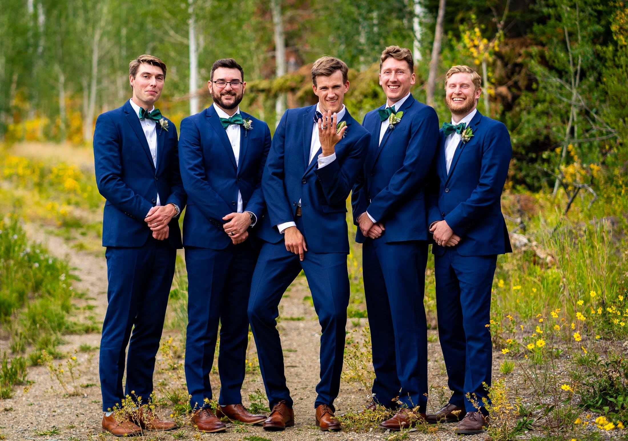 Groom and groomsmen pose for a portrait surrounded by aspens in a meadow, wedding, wedding photos, wedding photography, wedding photographer, wedding inspiration, wedding photo inspiration, wedding portraits, wedding ceremony, wedding reception, mountain wedding, Catholic Church wedding, Catholic Church wedding photos, Catholic Church wedding photography, Catholic Church wedding photographer, Catholic Church wedding inspiration, Catholic Church wedding venue, Steamboat Springs wedding, Steamboat Springs wedding photos, Steamboat Springs wedding photography, Steamboat Springs wedding photographer, Colorado wedding, Colorado wedding photos, Colorado wedding photography, Colorado wedding photographer, Colorado mountain wedding, Colorado wedding inspiration