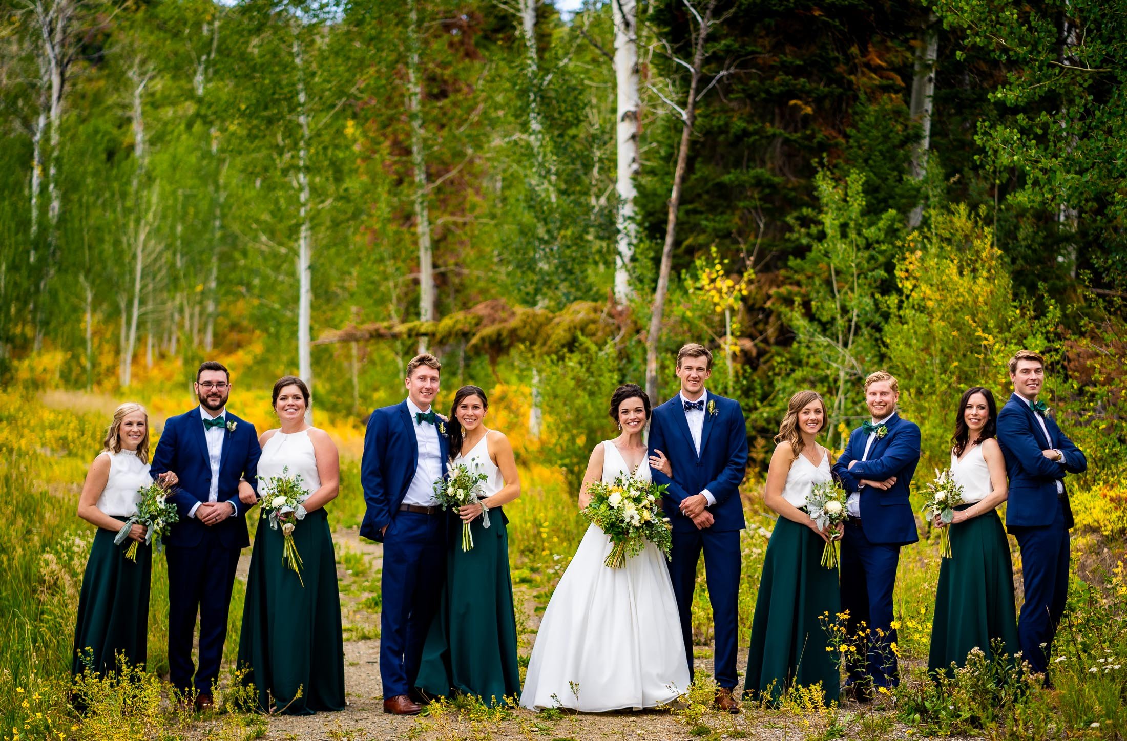 Bride and groom pose for a portrait with their wedding party portrait surrounded by aspens in a meadow, wedding, wedding photos, wedding photography, wedding photographer, wedding inspiration, wedding photo inspiration, wedding portraits, wedding ceremony, wedding reception, mountain wedding, Catholic Church wedding, Catholic Church wedding photos, Catholic Church wedding photography, Catholic Church wedding photographer, Catholic Church wedding inspiration, Catholic Church wedding venue, Steamboat Springs wedding, Steamboat Springs wedding photos, Steamboat Springs wedding photography, Steamboat Springs wedding photographer, Colorado wedding, Colorado wedding photos, Colorado wedding photography, Colorado wedding photographer, Colorado mountain wedding, Colorado wedding inspiration