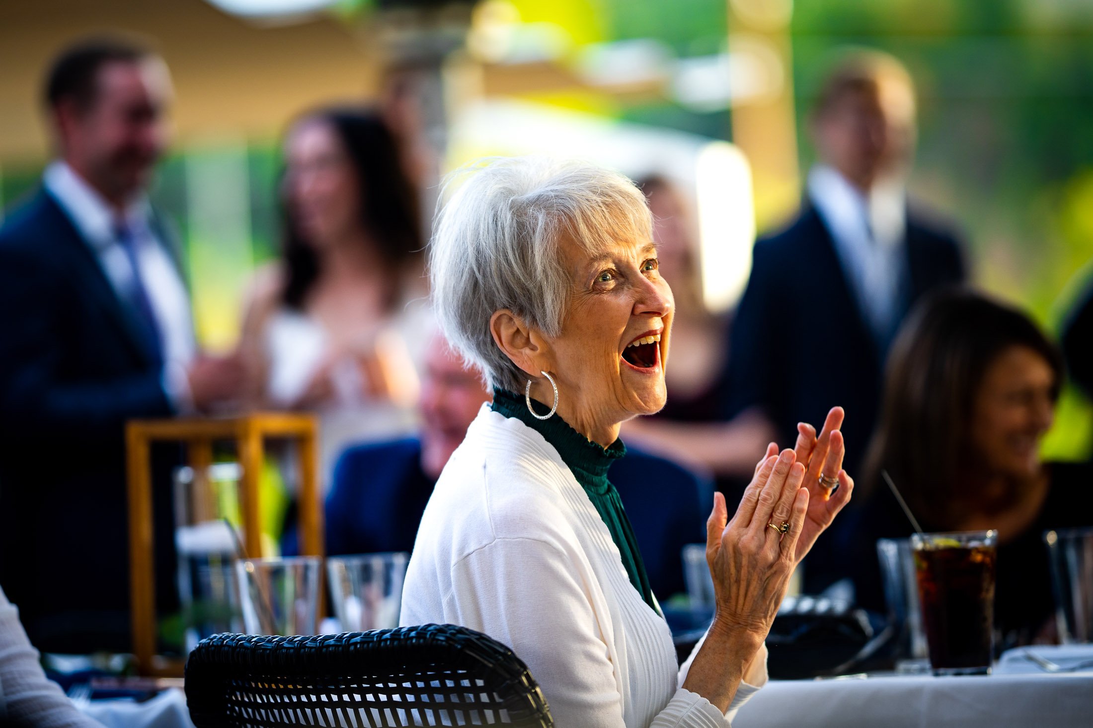 Guests react to speeches during the wedding reception, wedding, wedding photos, wedding photography, wedding photographer, wedding inspiration, wedding photo inspiration, wedding portraits, wedding ceremony, wedding reception, mountain wedding, Catholic Church wedding, Catholic Church wedding photos, Catholic Church wedding photography, Catholic Church wedding photographer, Catholic Church wedding inspiration, Catholic Church wedding venue, Steamboat Springs wedding, Steamboat Springs wedding photos, Steamboat Springs wedding photography, Steamboat Springs wedding photographer, Colorado wedding, Colorado wedding photos, Colorado wedding photography, Colorado wedding photographer, Colorado mountain wedding, Colorado wedding inspiration