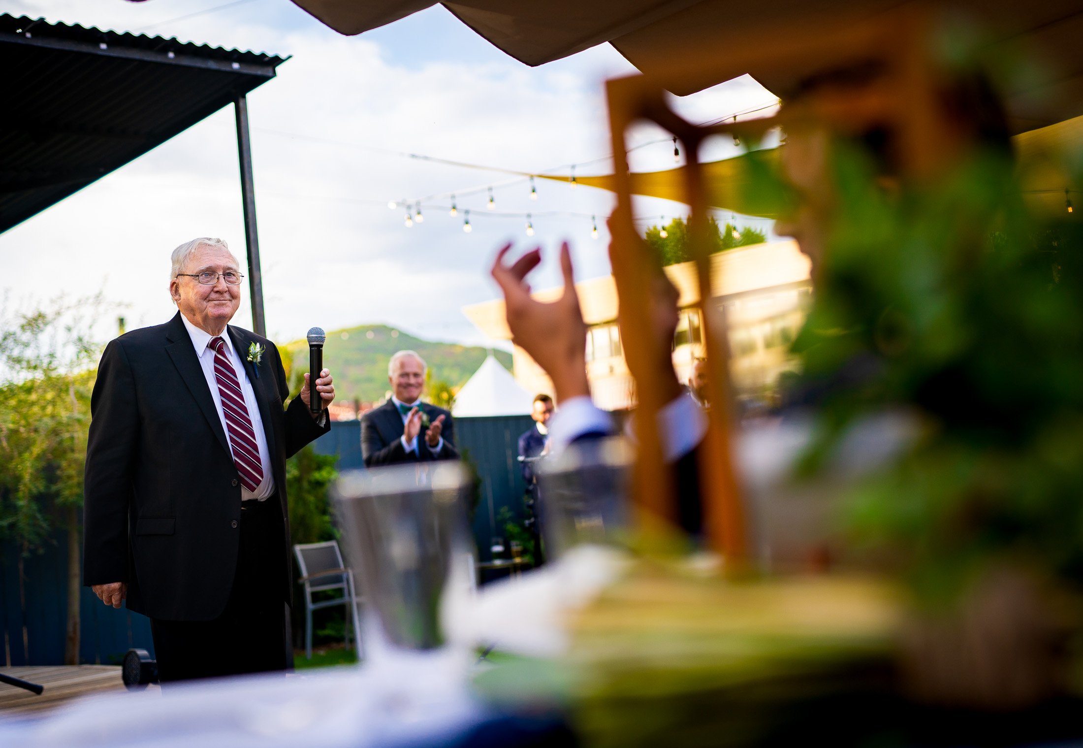 Guests react to speeches during the wedding reception, wedding, wedding photos, wedding photography, wedding photographer, wedding inspiration, wedding photo inspiration, wedding portraits, wedding ceremony, wedding reception, mountain wedding, Catholic Church wedding, Catholic Church wedding photos, Catholic Church wedding photography, Catholic Church wedding photographer, Catholic Church wedding inspiration, Catholic Church wedding venue, Steamboat Springs wedding, Steamboat Springs wedding photos, Steamboat Springs wedding photography, Steamboat Springs wedding photographer, Colorado wedding, Colorado wedding photos, Colorado wedding photography, Colorado wedding photographer, Colorado mountain wedding, Colorado wedding inspiration