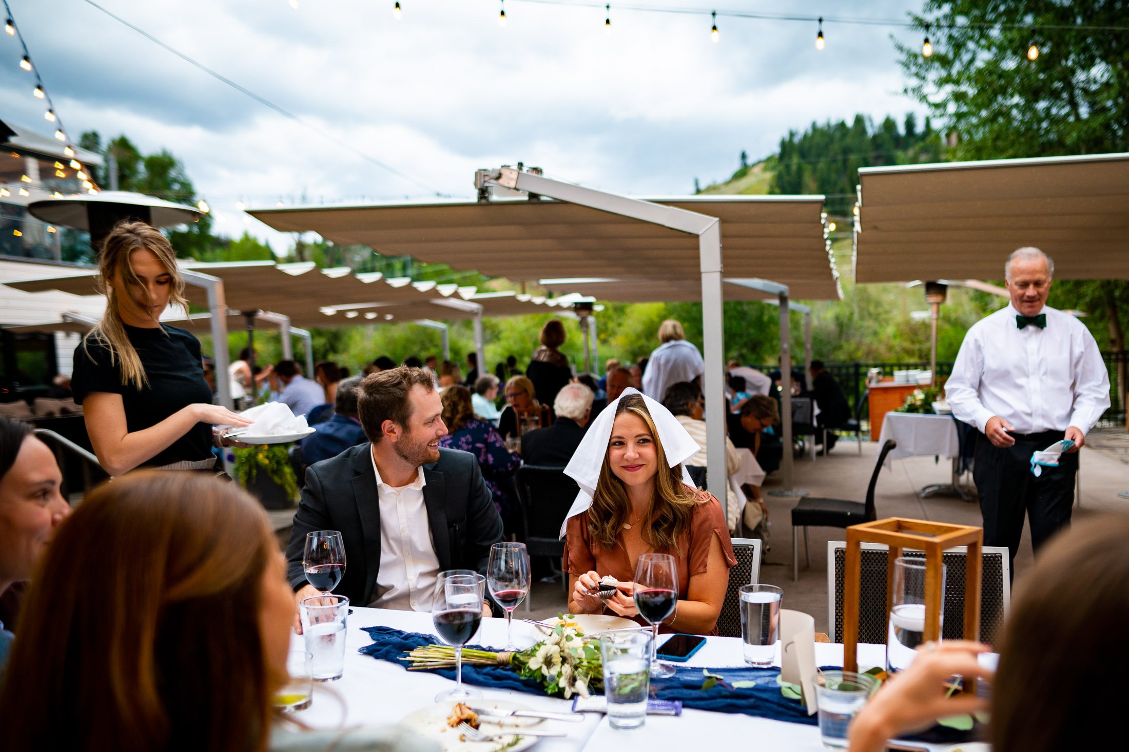 Bride and groom mingle with guests during their wedding reception, wedding, wedding photos, wedding photography, wedding photographer, wedding inspiration, wedding photo inspiration, wedding portraits, wedding ceremony, wedding reception, mountain wedding, Catholic Church wedding, Catholic Church wedding photos, Catholic Church wedding photography, Catholic Church wedding photographer, Catholic Church wedding inspiration, Catholic Church wedding venue, Steamboat Springs wedding, Steamboat Springs wedding photos, Steamboat Springs wedding photography, Steamboat Springs wedding photographer, Colorado wedding, Colorado wedding photos, Colorado wedding photography, Colorado wedding photographer, Colorado mountain wedding, Colorado wedding inspiration