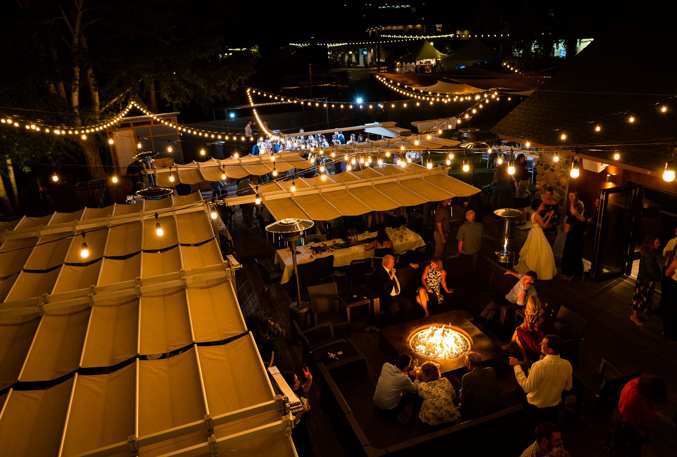 Guests dance to music on the outdoor patio under cafe lights during the wedding reception, wedding, wedding photos, wedding photography, wedding photographer, wedding inspiration, wedding photo inspiration, wedding portraits, wedding ceremony, wedding reception, mountain wedding, Catholic Church wedding, Catholic Church wedding photos, Catholic Church wedding photography, Catholic Church wedding photographer, Catholic Church wedding inspiration, Catholic Church wedding venue, Steamboat Springs wedding, Steamboat Springs wedding photos, Steamboat Springs wedding photography, Steamboat Springs wedding photographer, Colorado wedding, Colorado wedding photos, Colorado wedding photography, Colorado wedding photographer, Colorado mountain wedding, Colorado wedding inspiration