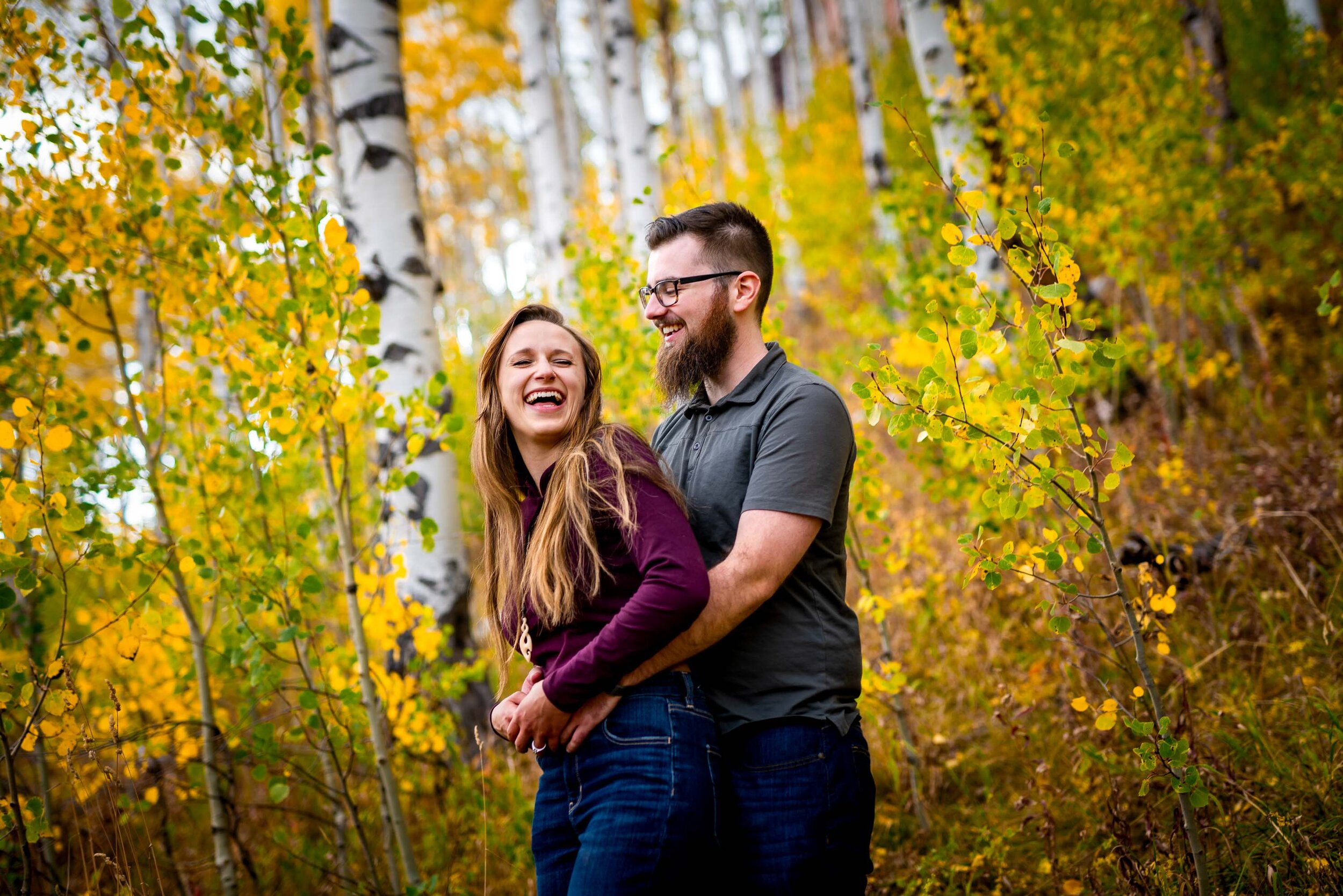 Engaged couple embraces for a portrait while surrounded by golden Aspen trees, Engagement Session, Engagement Photos, Engagement Photos Inspiration, Engagement Photography, Engagement Photographer, Fall Engagement Photos, Mountain Engagement Photos, Piney River Ranch engagement photos, Vail engagement session, Vail engagement photos, Vail engagement photography, Vail engagement photographer, Vail engagement inspiration, Colorado engagement session, Colorado engagement photos, Colorado engagement photography, Colorado engagement photographer, Colorado engagement inspiration