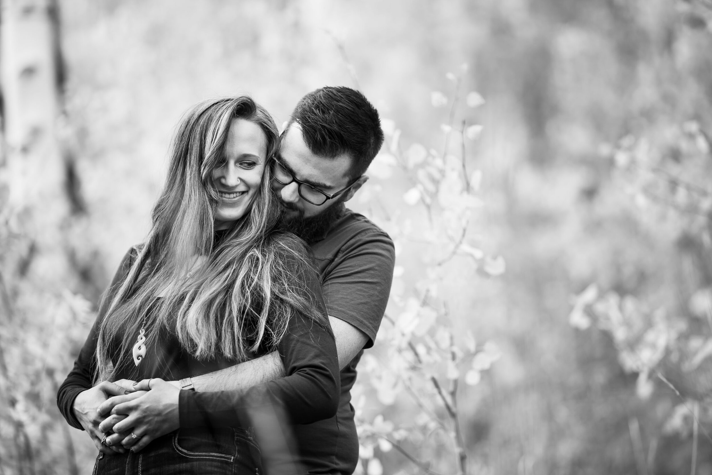 Engaged couple embraces for a portrait while surrounded by golden Aspen trees, Engagement Session, Engagement Photos, Engagement Photos Inspiration, Engagement Photography, Engagement Photographer, Fall Engagement Photos, Mountain Engagement Photos, Piney River Ranch engagement photos, Vail engagement session, Vail engagement photos, Vail engagement photography, Vail engagement photographer, Vail engagement inspiration, Colorado engagement session, Colorado engagement photos, Colorado engagement photography, Colorado engagement photographer, Colorado engagement inspiration