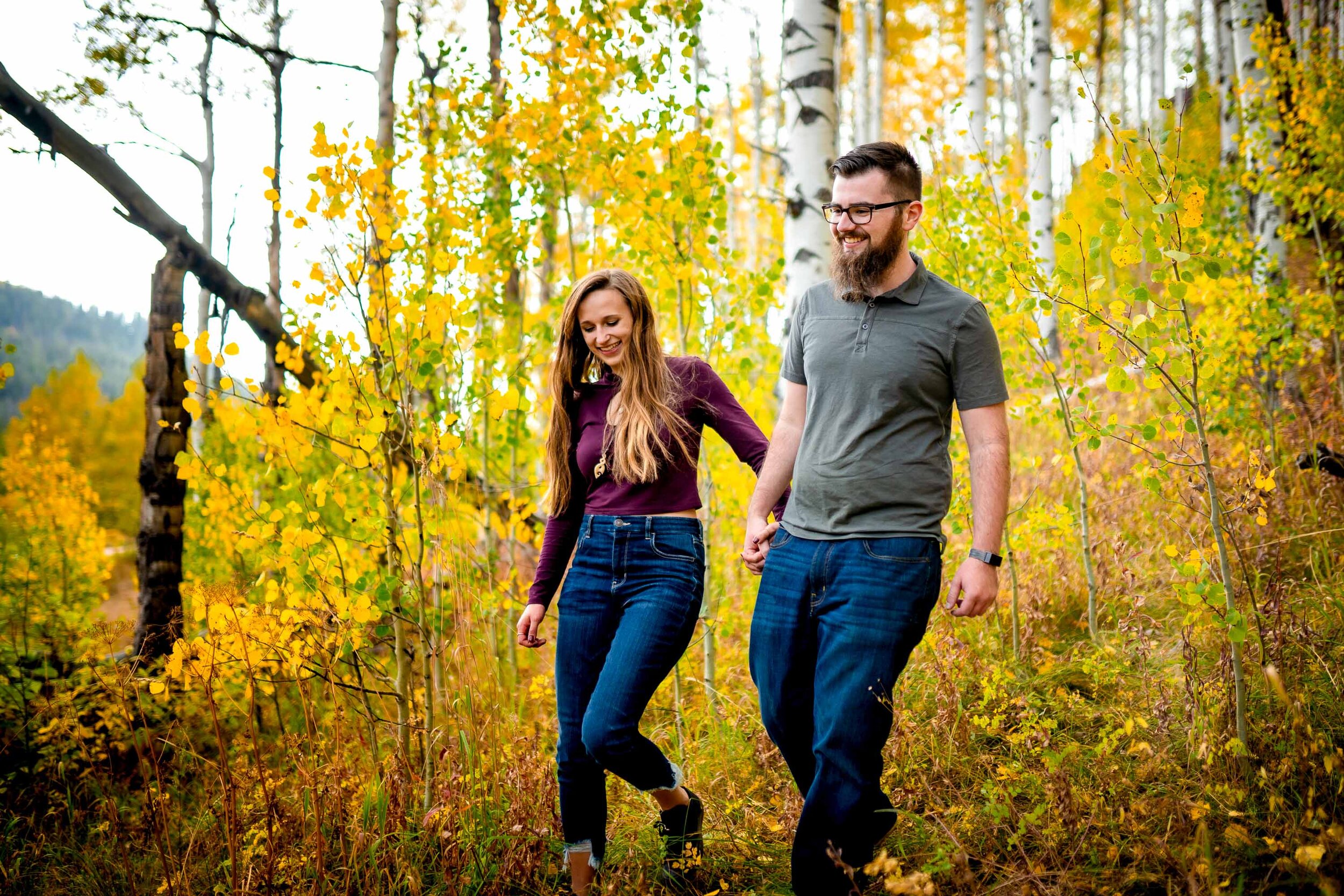 Engaged couple embraces for a portrait while surrounded by golden Aspen trees, Engagement Session, Engagement Photos, Engagement Photos Inspiration, Engagement Photography, Engagement Photographer, Fall Engagement Photos, Mountain Engagement Photos, Piney River Ranch engagement photos, Vail engagement session, Vail engagement photos, Vail engagement photography, Vail engagement photographer, Vail engagement inspiration, Colorado engagement session, Colorado engagement photos, Colorado engagement photography, Colorado engagement photographer, Colorado engagement inspiration