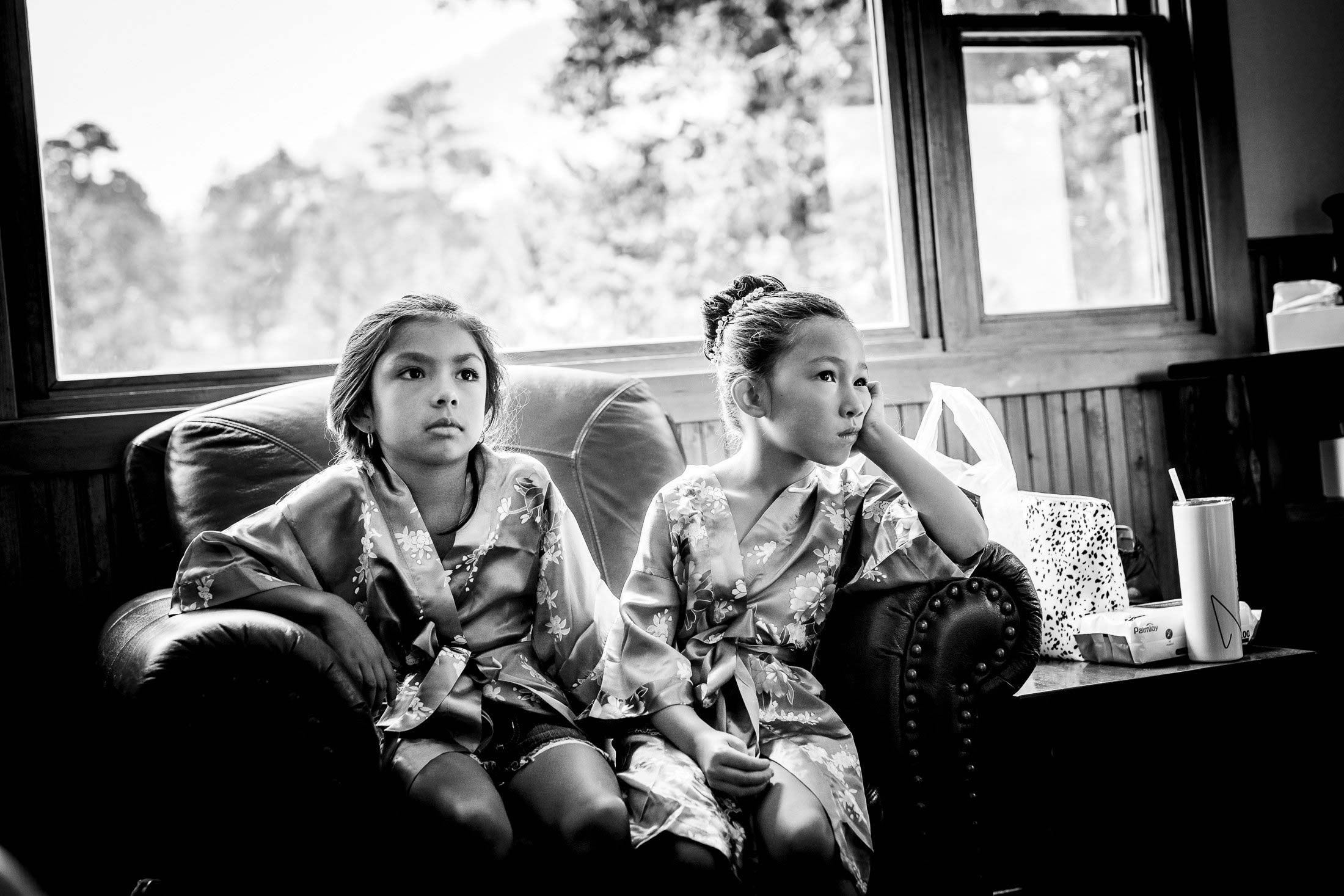 Nieces watch the bride get her hair and make-up done in the bridal suite cabin, wedding, wedding photos, wedding photography, wedding photographer, wedding inspiration, wedding photo inspiration, mountain wedding, YMCA of the Rockies wedding, YMCA of the Rockies wedding photos, YMCA of the Rockies wedding photography, YMCA of the Rockies wedding photographer, YMCA of the Rockies wedding inspiration, YMCA of the Rockies wedding venue, Estes Park wedding, Estes Park wedding photos, Estes Park wedding photography, Estes Park wedding photographer, Colorado wedding, Colorado wedding photos, Colorado wedding photography, Colorado wedding photographer, Colorado mountain wedding, Colorado wedding inspiration