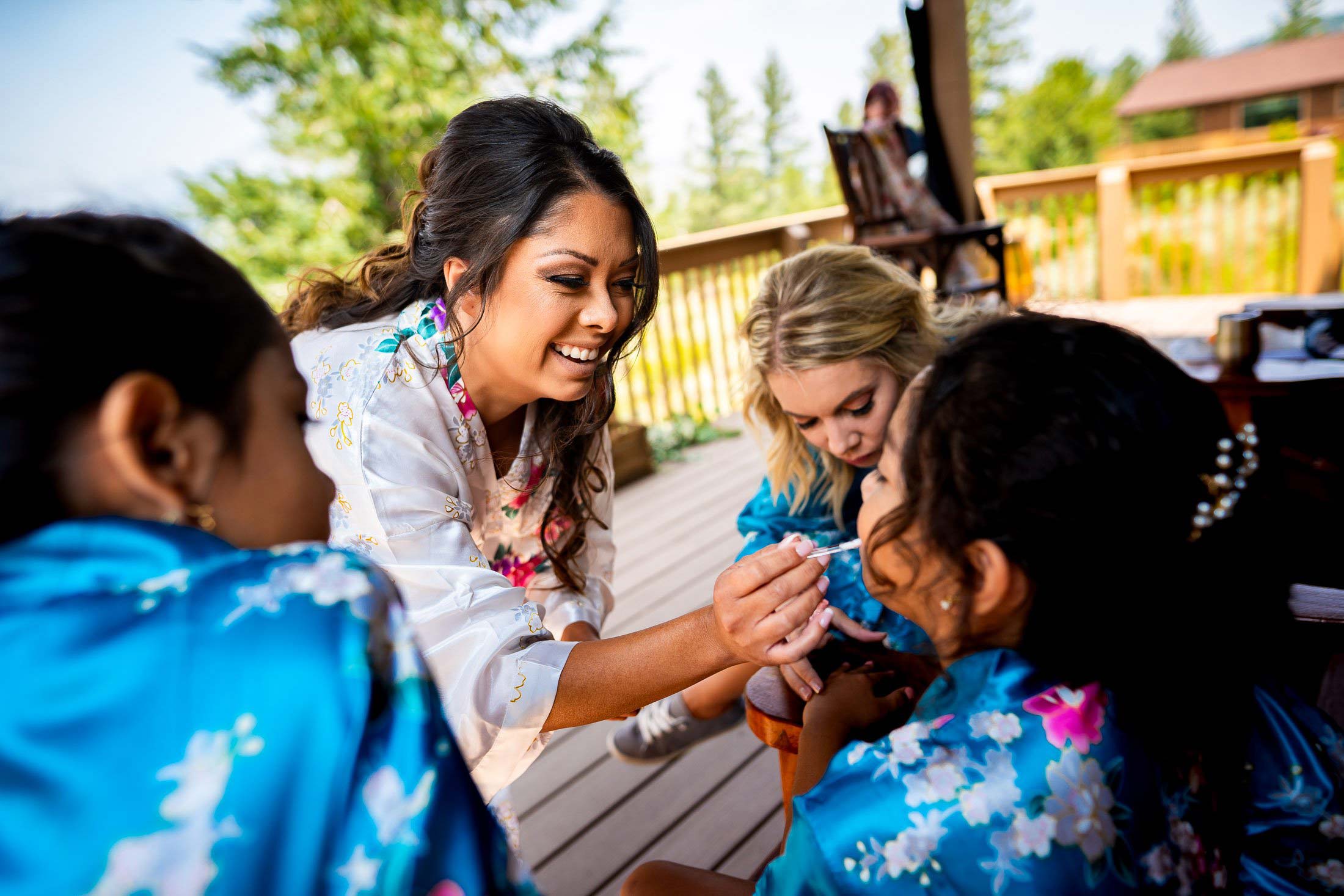 Bride does the make-up of her nieces in the bridal suite cabin, wedding, wedding photos, wedding photography, wedding photographer, wedding inspiration, wedding photo inspiration, mountain wedding, YMCA of the Rockies wedding, YMCA of the Rockies wedding photos, YMCA of the Rockies wedding photography, YMCA of the Rockies wedding photographer, YMCA of the Rockies wedding inspiration, YMCA of the Rockies wedding venue, Estes Park wedding, Estes Park wedding photos, Estes Park wedding photography, Estes Park wedding photographer, Colorado wedding, Colorado wedding photos, Colorado wedding photography, Colorado wedding photographer, Colorado mountain wedding, Colorado wedding inspiration