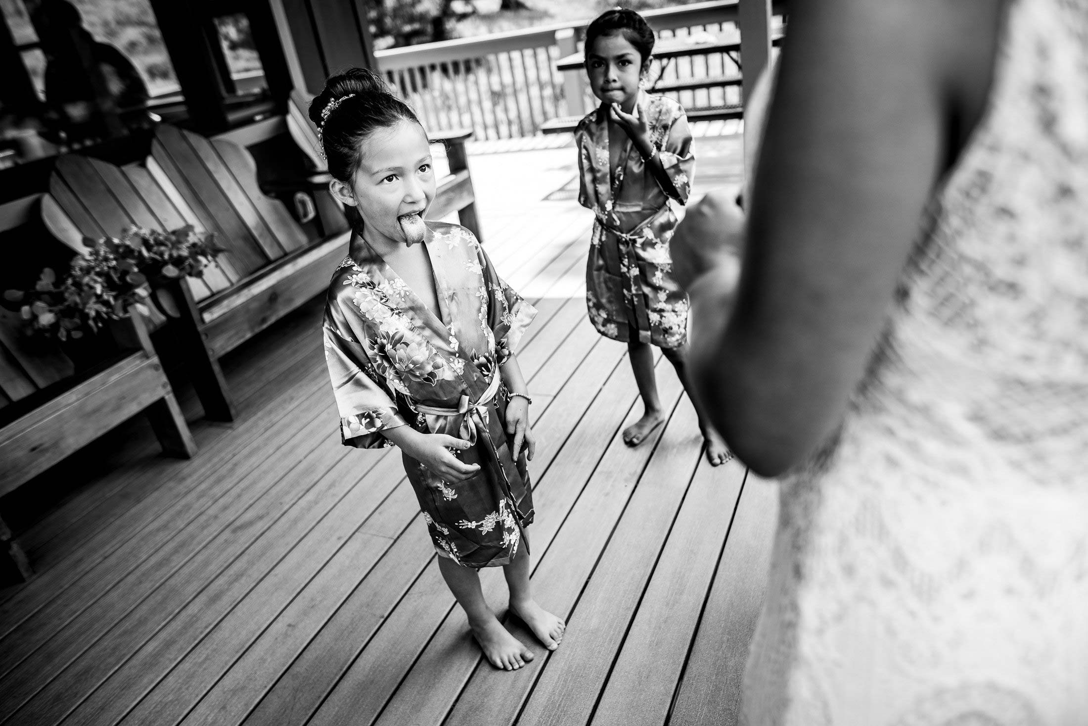 Kids do each other's make-up in the on the deck of the bridal suite cabin, wedding, wedding photos, wedding photography, wedding photographer, wedding inspiration, wedding photo inspiration, mountain wedding, YMCA of the Rockies wedding, YMCA of the Rockies wedding photos, YMCA of the Rockies wedding photography, YMCA of the Rockies wedding photographer, YMCA of the Rockies wedding inspiration, YMCA of the Rockies wedding venue, Estes Park wedding, Estes Park wedding photos, Estes Park wedding photography, Estes Park wedding photographer, Colorado wedding, Colorado wedding photos, Colorado wedding photography, Colorado wedding photographer, Colorado mountain wedding, Colorado wedding inspiration