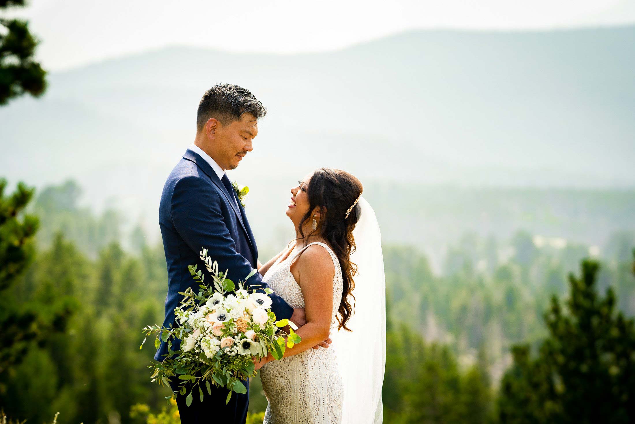 Bride and Groom pose for newlywed portraits in Rocky Mountain National Park, wedding, wedding photos, wedding photography, wedding photographer, wedding inspiration, wedding photo inspiration, mountain wedding, YMCA of the Rockies wedding, YMCA of the Rockies wedding photos, YMCA of the Rockies wedding photography, YMCA of the Rockies wedding photographer, YMCA of the Rockies wedding inspiration, YMCA of the Rockies wedding venue, Estes Park wedding, Estes Park wedding photos, Estes Park wedding photography, Estes Park wedding photographer, Colorado wedding, Colorado wedding photos, Colorado wedding photography, Colorado wedding photographer, Colorado mountain wedding, Colorado wedding inspiration