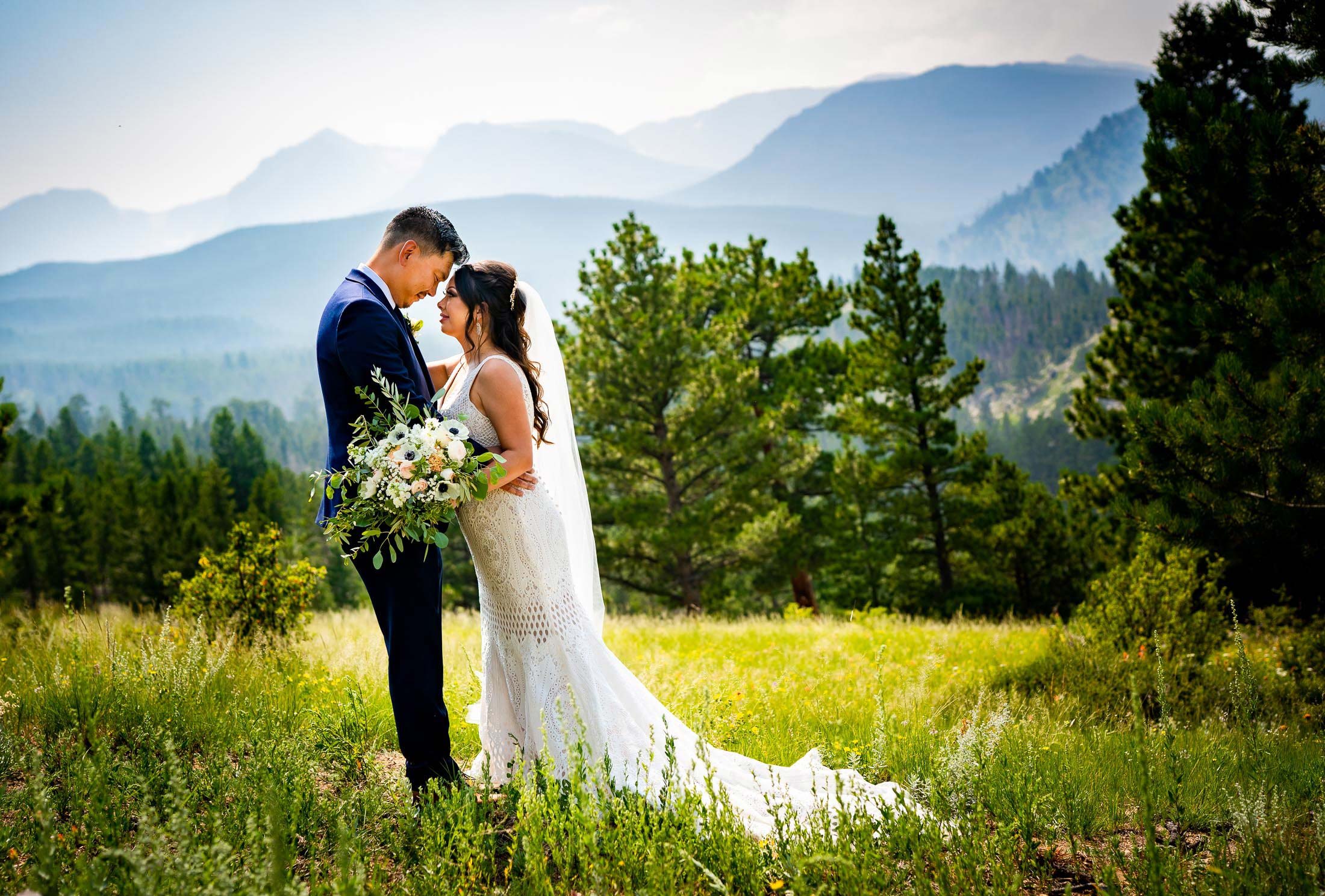 Bride and Groom pose for newlywed portraits in Rocky Mountain National Park, wedding, wedding photos, wedding photography, wedding photographer, wedding inspiration, wedding photo inspiration, mountain wedding, YMCA of the Rockies wedding, YMCA of the Rockies wedding photos, YMCA of the Rockies wedding photography, YMCA of the Rockies wedding photographer, YMCA of the Rockies wedding inspiration, YMCA of the Rockies wedding venue, Estes Park wedding, Estes Park wedding photos, Estes Park wedding photography, Estes Park wedding photographer, Colorado wedding, Colorado wedding photos, Colorado wedding photography, Colorado wedding photographer, Colorado mountain wedding, Colorado wedding inspiration