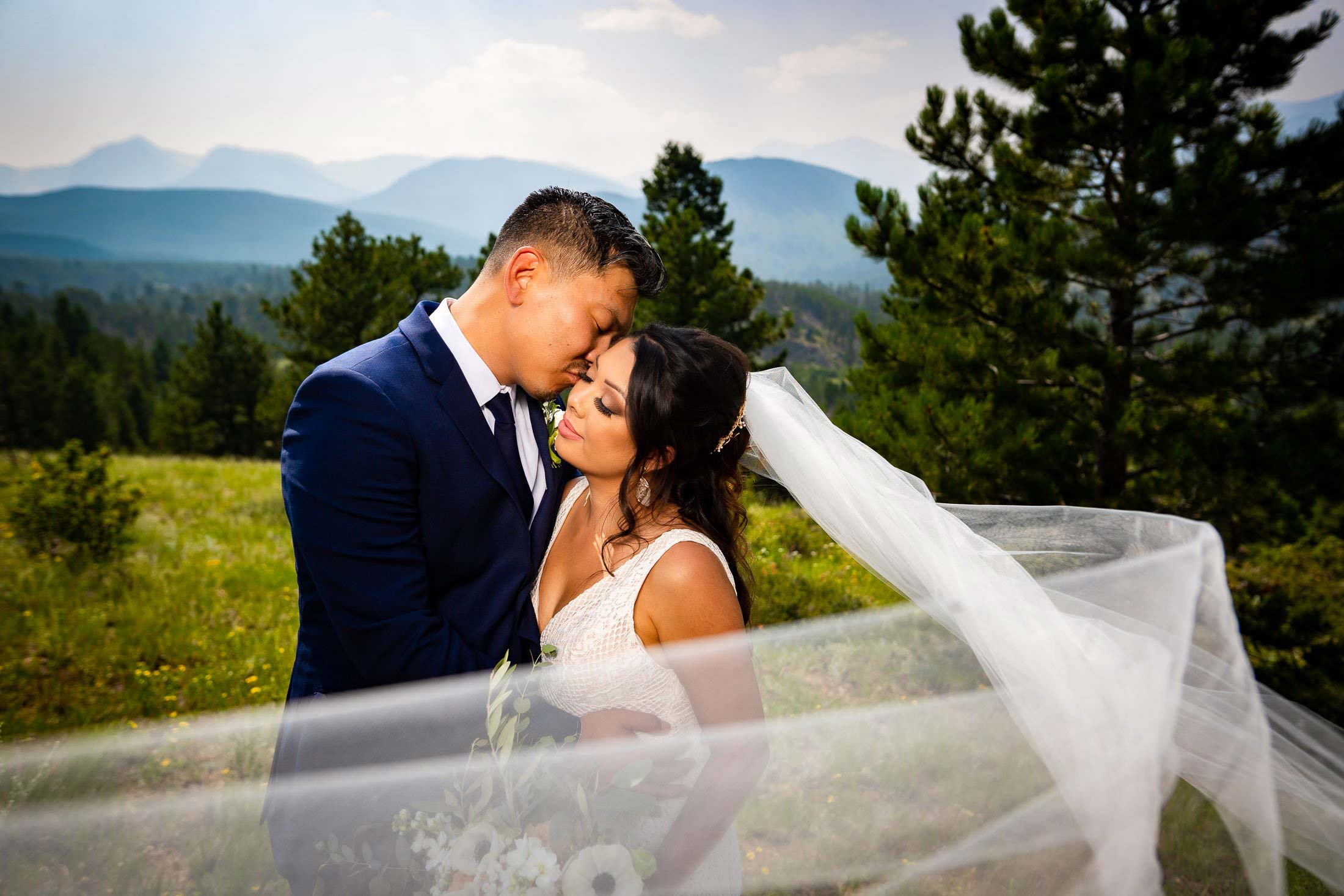 Bride and Groom pose for newlywed portraits in Rocky Mountain National Park, wedding, wedding photos, wedding photography, wedding photographer, wedding inspiration, wedding photo inspiration, mountain wedding, YMCA of the Rockies wedding, YMCA of the Rockies wedding photos, YMCA of the Rockies wedding photography, YMCA of the Rockies wedding photographer, YMCA of the Rockies wedding inspiration, YMCA of the Rockies wedding venue, Estes Park wedding, Estes Park wedding photos, Estes Park wedding photography, Estes Park wedding photographer, Colorado wedding, Colorado wedding photos, Colorado wedding photography, Colorado wedding photographer, Colorado mountain wedding, Colorado wedding inspiration