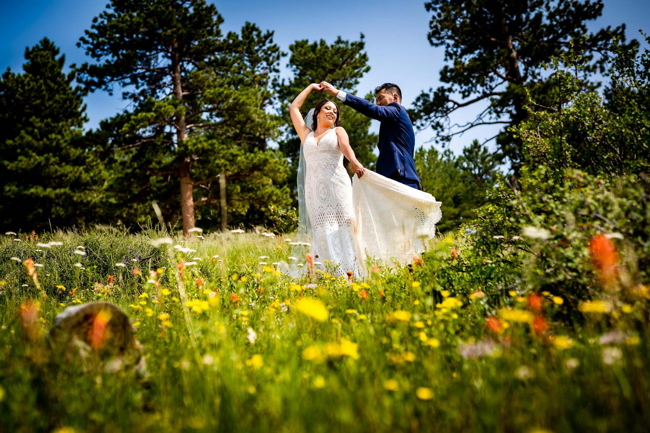 Bride and Groom pose for newlywed portraits in Rocky Mountain National Park, wedding, wedding photos, wedding photography, wedding photographer, wedding inspiration, wedding photo inspiration, mountain wedding, YMCA of the Rockies wedding, YMCA of the Rockies wedding photos, YMCA of the Rockies wedding photography, YMCA of the Rockies wedding photographer, YMCA of the Rockies wedding inspiration, YMCA of the Rockies wedding venue, Estes Park wedding, Estes Park wedding photos, Estes Park wedding photography, Estes Park wedding photographer, Colorado wedding, Colorado wedding photos, Colorado wedding photography, Colorado wedding photographer, Colorado mountain wedding, Colorado wedding inspiration