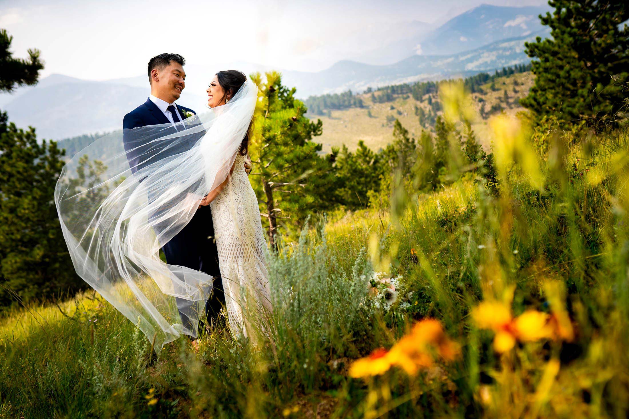 Bride and Groom pose for newlywed portraits in Rocky Mountain National Park, wedding, wedding photos, wedding photography, wedding photographer, wedding inspiration, wedding photo inspiration, mountain wedding, YMCA of the Rockies wedding, YMCA of the Rockies wedding photos, YMCA of the Rockies wedding photography, YMCA of the Rockies wedding photographer, YMCA of the Rockies wedding inspiration, YMCA of the Rockies wedding venue, Estes Park wedding, Estes Park wedding photos, Estes Park wedding photography, Estes Park wedding photographer, Colorado wedding, Colorado wedding photos, Colorado wedding photography, Colorado wedding photographer, Colorado mountain wedding, Colorado wedding inspiration