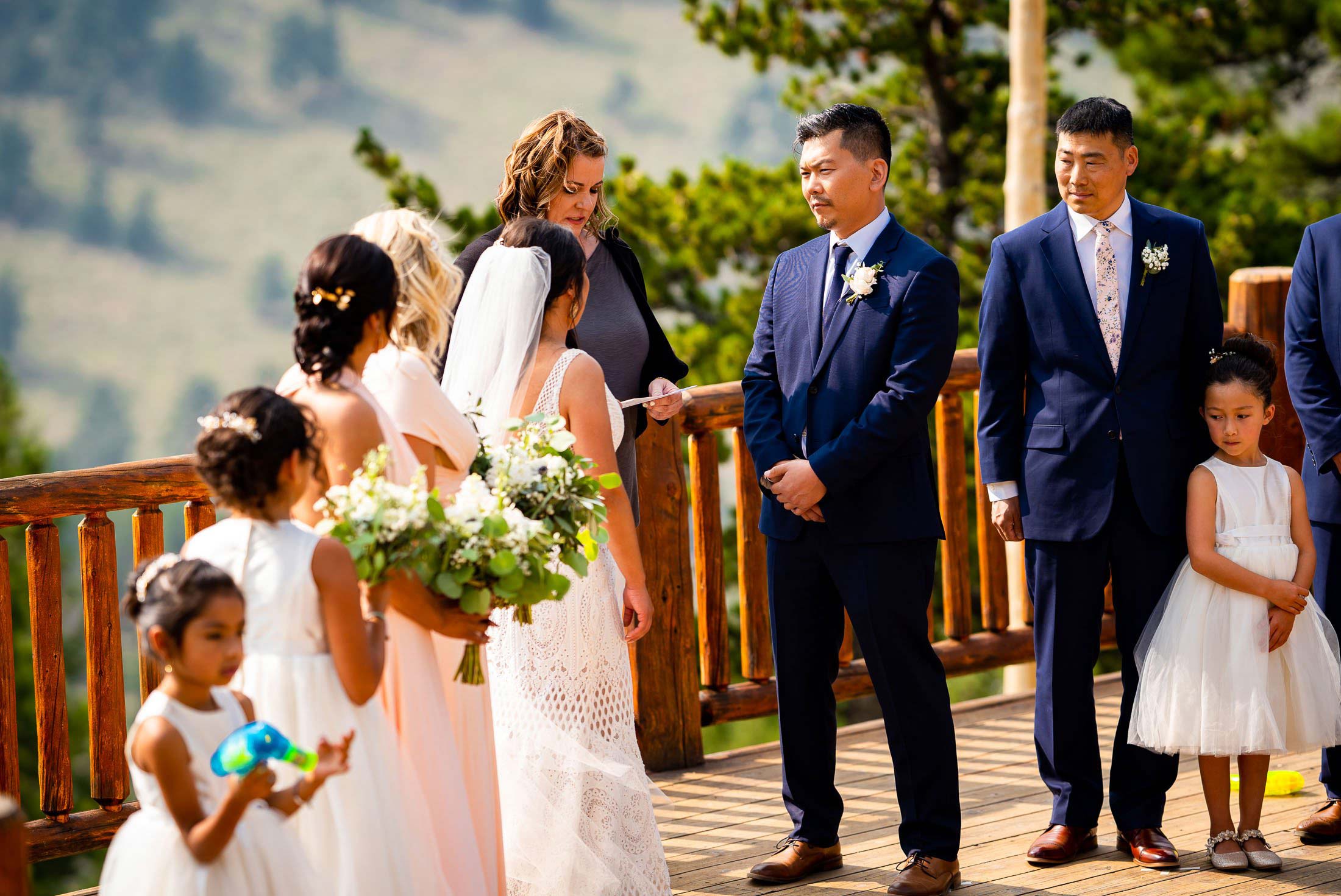 Groom stares into the eyes of his bride during their wedding ceremony in the mountains, wedding photos, wedding photography, wedding photographer, wedding inspiration, wedding photo inspiration, mountain wedding, YMCA of the Rockies wedding, YMCA of the Rockies wedding photos, YMCA of the Rockies wedding photography, YMCA of the Rockies wedding photographer, YMCA of the Rockies wedding inspiration, YMCA of the Rockies wedding venue, Estes Park wedding, Estes Park wedding photos, Estes Park wedding photography, Estes Park wedding photographer, Colorado wedding, Colorado wedding photos, Colorado wedding photography, Colorado wedding photographer, Colorado mountain wedding, Colorado wedding inspiration