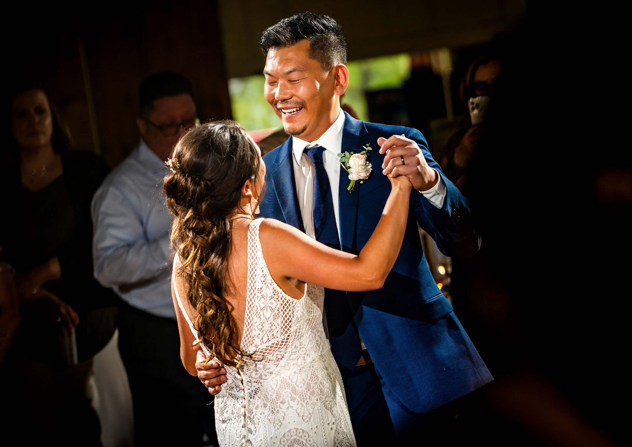 Bride and groom have their first dance in the reception hall as family and friends watch, wedding photos, wedding photography, wedding photographer, wedding inspiration, wedding photo inspiration, mountain wedding, YMCA of the Rockies wedding, YMCA of the Rockies wedding photos, YMCA of the Rockies wedding photography, YMCA of the Rockies wedding photographer, YMCA of the Rockies wedding inspiration, YMCA of the Rockies wedding venue, Estes Park wedding, Estes Park wedding photos, Estes Park wedding photography, Estes Park wedding photographer, Colorado wedding, Colorado wedding photos, Colorado wedding photography, Colorado wedding photographer, Colorado mountain wedding, Colorado wedding inspiration