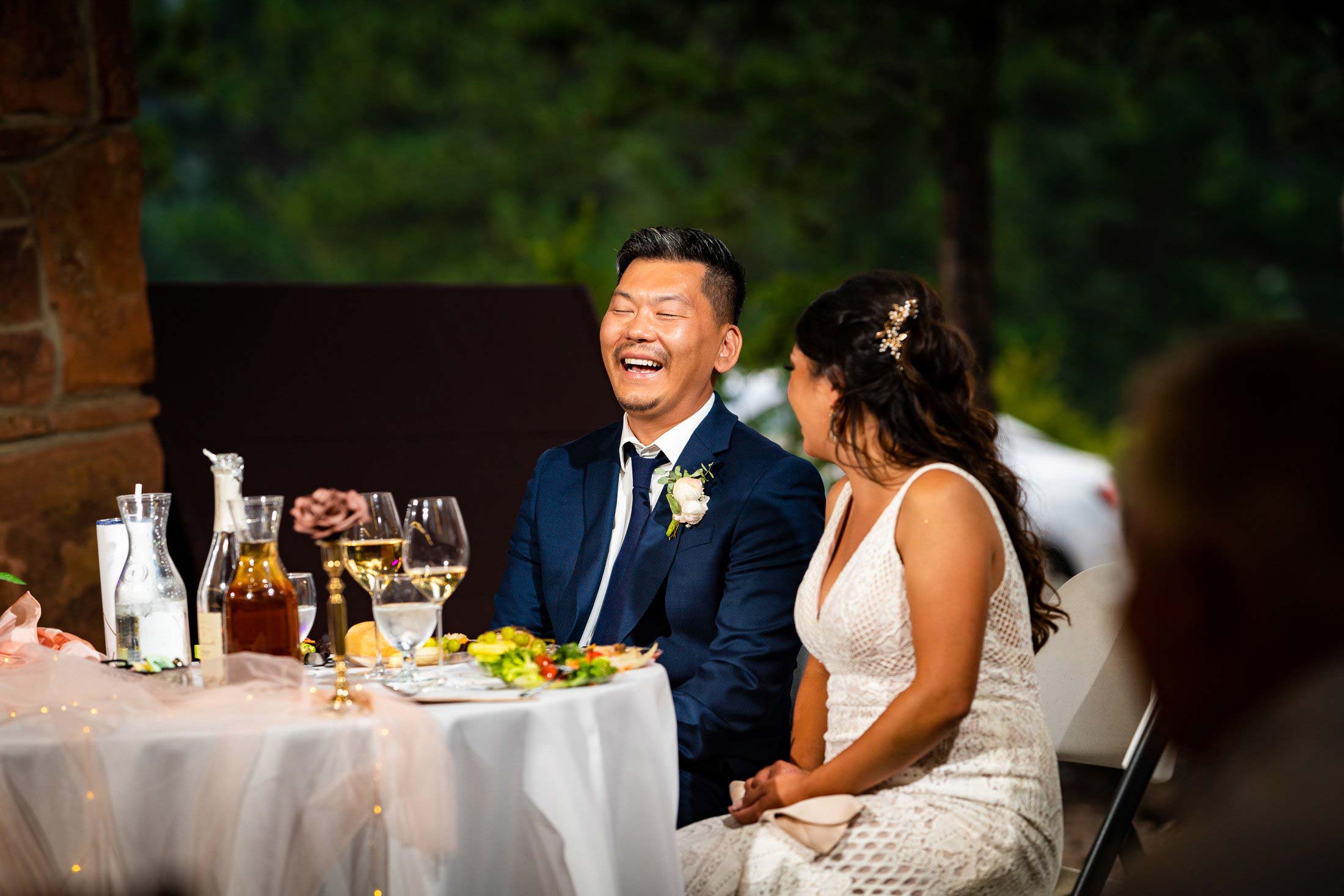 Bride and groom laugh during a toast by a the maid of honor during the reception, wedding photos, wedding photography, wedding photographer, wedding inspiration, wedding photo inspiration, mountain wedding, YMCA of the Rockies wedding, YMCA of the Rockies wedding photos, YMCA of the Rockies wedding photography, YMCA of the Rockies wedding photographer, YMCA of the Rockies wedding inspiration, YMCA of the Rockies wedding venue, Estes Park wedding, Estes Park wedding photos, Estes Park wedding photography, Estes Park wedding photographer, Colorado wedding, Colorado wedding photos, Colorado wedding photography, Colorado wedding photographer, Colorado mountain wedding, Colorado wedding inspiration