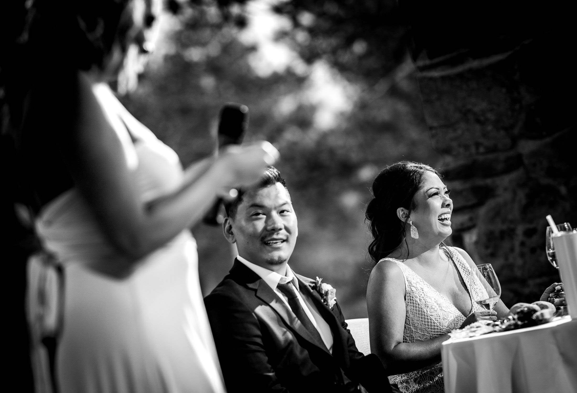 Bride and groom laugh during a toast by a the maid of honor during the reception, wedding photos, wedding photography, wedding photographer, wedding inspiration, wedding photo inspiration, mountain wedding, YMCA of the Rockies wedding, YMCA of the Rockies wedding photos, YMCA of the Rockies wedding photography, YMCA of the Rockies wedding photographer, YMCA of the Rockies wedding inspiration, YMCA of the Rockies wedding venue, Estes Park wedding, Estes Park wedding photos, Estes Park wedding photography, Estes Park wedding photographer, Colorado wedding, Colorado wedding photos, Colorado wedding photography, Colorado wedding photographer, Colorado mountain wedding, Colorado wedding inspiration