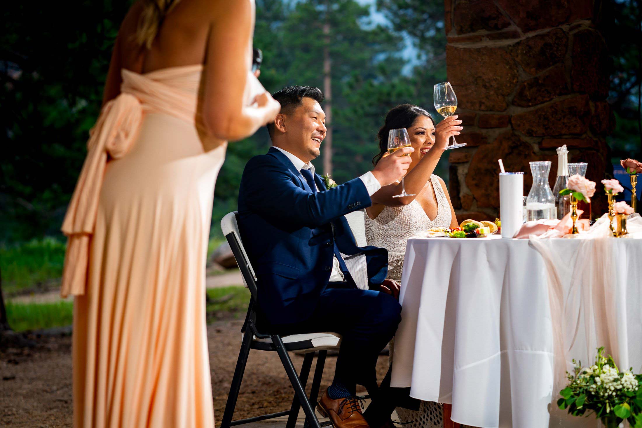 Bride and groom laugh during a toast by a the maid of honor during the reception, wedding photos, wedding photography, wedding photographer, wedding inspiration, wedding photo inspiration, mountain wedding, YMCA of the Rockies wedding, YMCA of the Rockies wedding photos, YMCA of the Rockies wedding photography, YMCA of the Rockies wedding photographer, YMCA of the Rockies wedding inspiration, YMCA of the Rockies wedding venue, Estes Park wedding, Estes Park wedding photos, Estes Park wedding photography, Estes Park wedding photographer, Colorado wedding, Colorado wedding photos, Colorado wedding photography, Colorado wedding photographer, Colorado mountain wedding, Colorado wedding inspiration