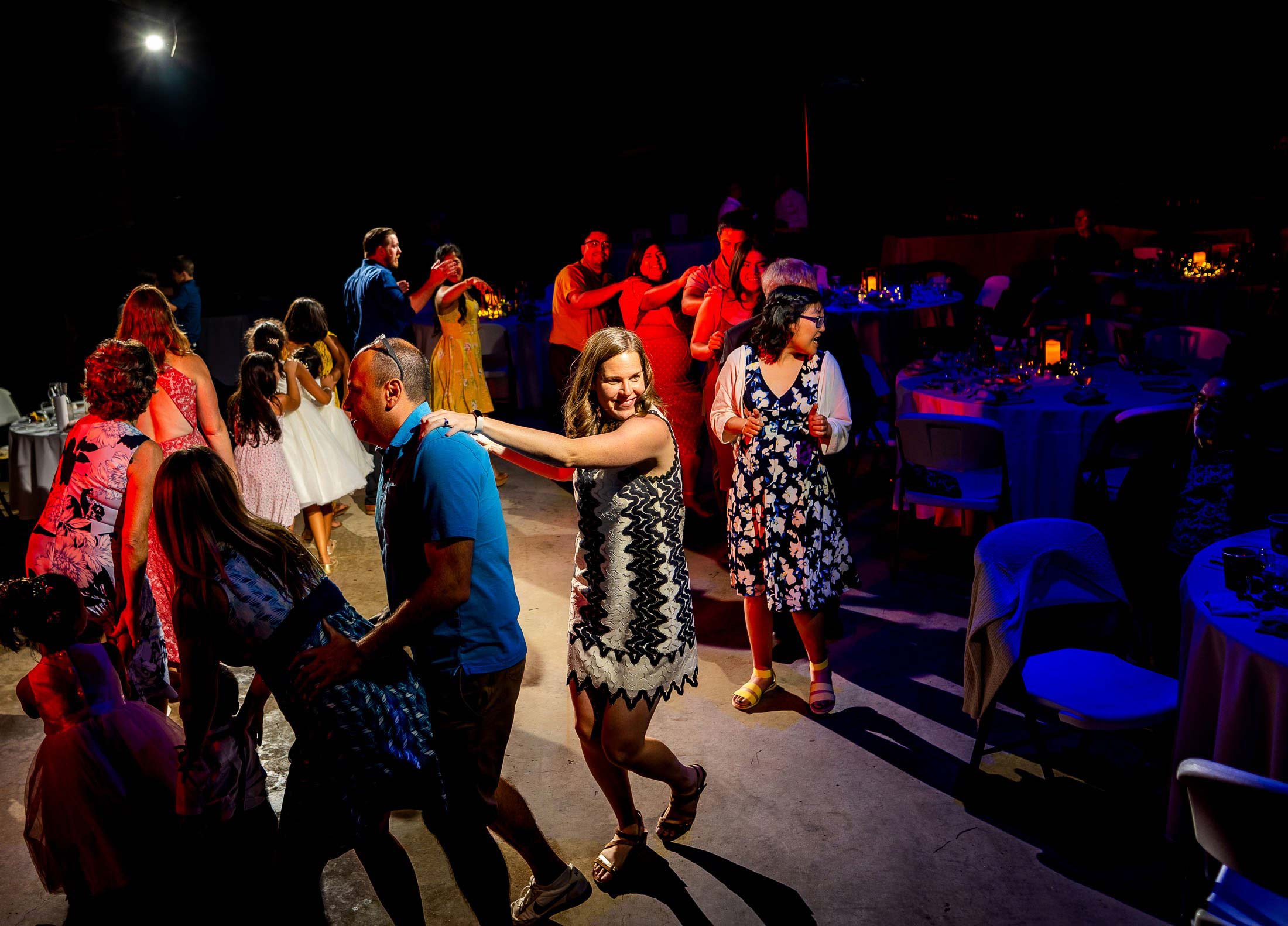 Guests dance to music in the hall during the wedding reception, wedding photos, wedding photography, wedding photographer, wedding inspiration, wedding photo inspiration, mountain wedding, YMCA of the Rockies wedding, YMCA of the Rockies wedding photos, YMCA of the Rockies wedding photography, YMCA of the Rockies wedding photographer, YMCA of the Rockies wedding inspiration, YMCA of the Rockies wedding venue, Estes Park wedding, Estes Park wedding photos, Estes Park wedding photography, Estes Park wedding photographer, Colorado wedding, Colorado wedding photos, Colorado wedding photography, Colorado wedding photographer, Colorado mountain wedding, Colorado wedding inspiration