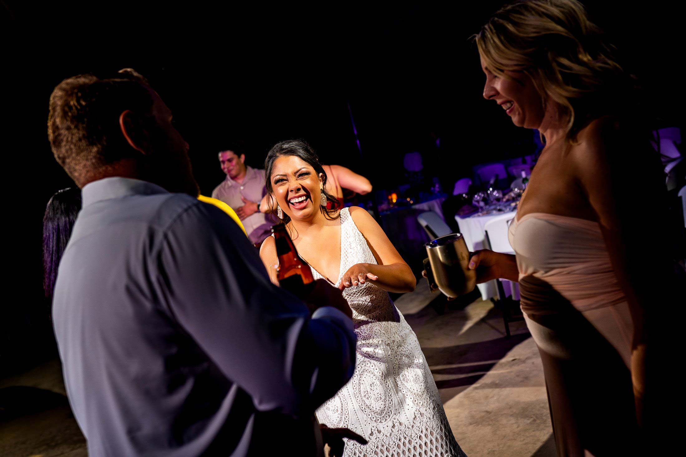 Guests dance to music in the hall during the wedding reception, wedding photos, wedding photography, wedding photographer, wedding inspiration, wedding photo inspiration, mountain wedding, YMCA of the Rockies wedding, YMCA of the Rockies wedding photos, YMCA of the Rockies wedding photography, YMCA of the Rockies wedding photographer, YMCA of the Rockies wedding inspiration, YMCA of the Rockies wedding venue, Estes Park wedding, Estes Park wedding photos, Estes Park wedding photography, Estes Park wedding photographer, Colorado wedding, Colorado wedding photos, Colorado wedding photography, Colorado wedding photographer, Colorado mountain wedding, Colorado wedding inspiration