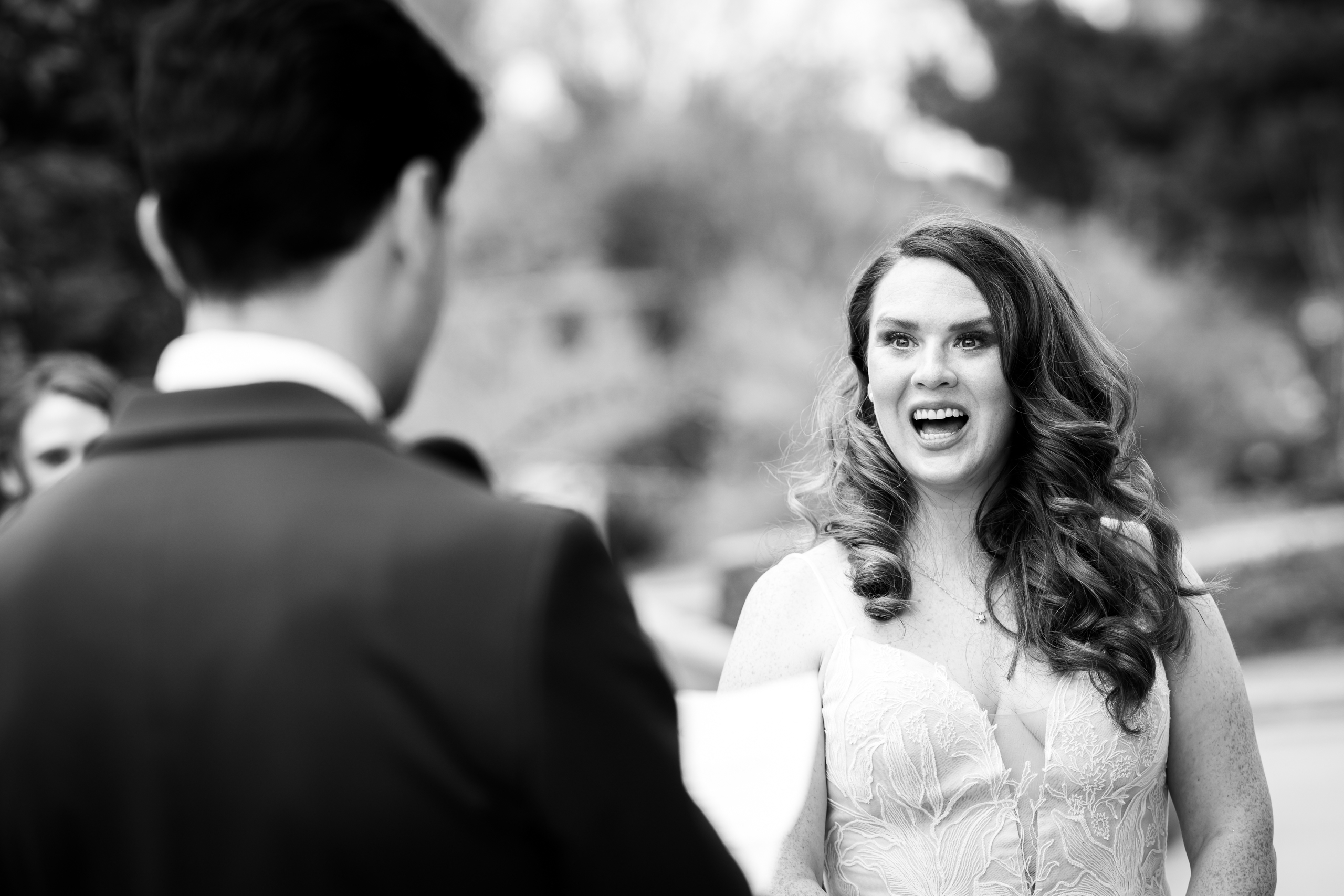 Bride reacts emotionally as the groom reads his vows aloud during their wedding ceremony, wedding photos, wedding photography, wedding photographer, wedding photo inspiration, Denver Botanic Garden wedding, Denver Botanic Garden wedding photos, Denver Botanic Garden wedding photography, Denver Botanic Garden wedding inspiration, Denver wedding venue, Denver wedding photos, Denver wedding photography, Denver wedding photographer, Colorado wedding photography