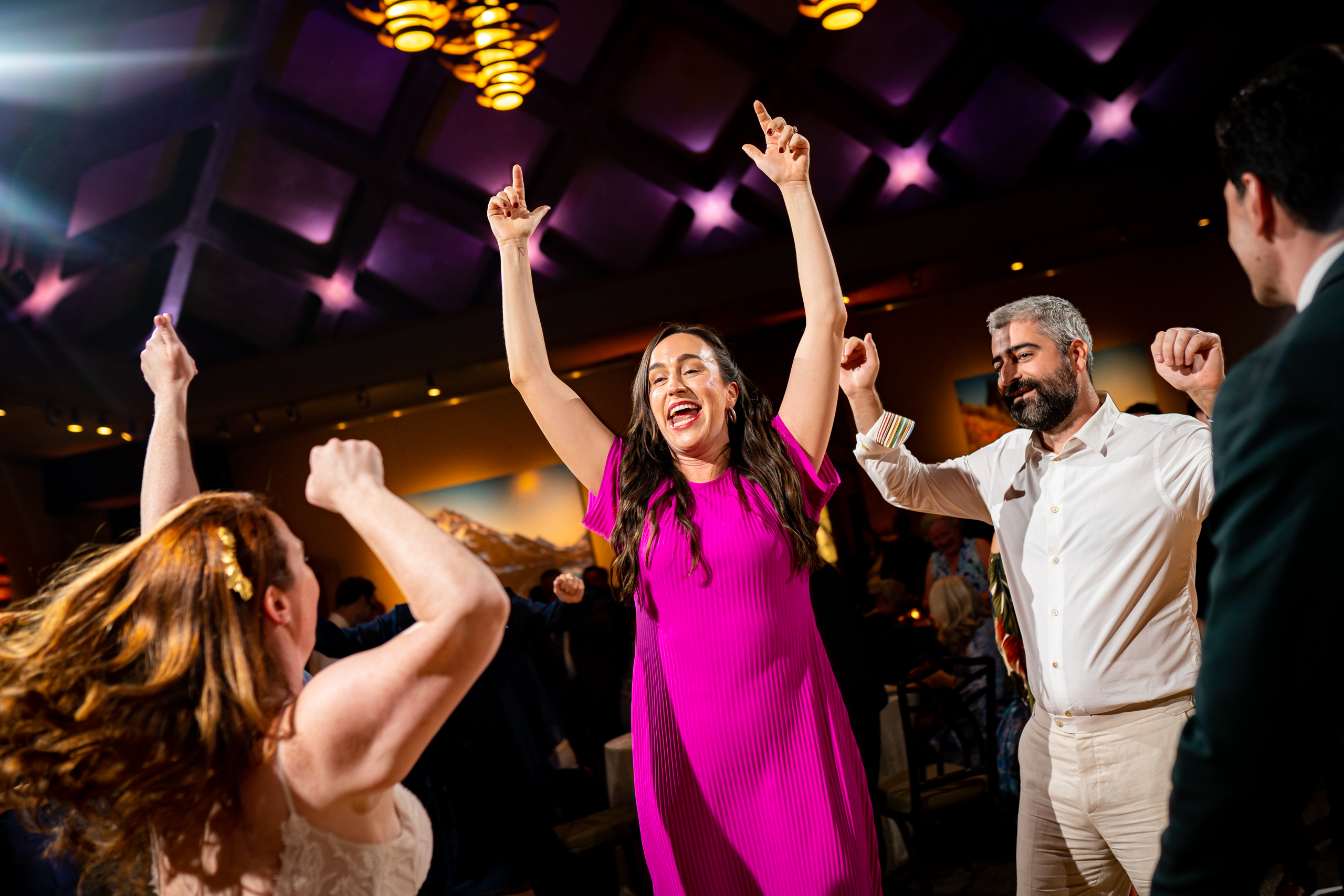 Guests dance to music on a colorful dance floor during the wedding reception, wedding photos, wedding photography, wedding photographer, wedding photo inspiration, Denver Botanic Garden wedding, Denver Botanic Garden wedding photos, Denver Botanic Garden wedding photography, Denver Botanic Garden wedding inspiration, Denver wedding venue, Denver wedding photos, Denver wedding photography, Denver wedding photographer, Colorado wedding photography