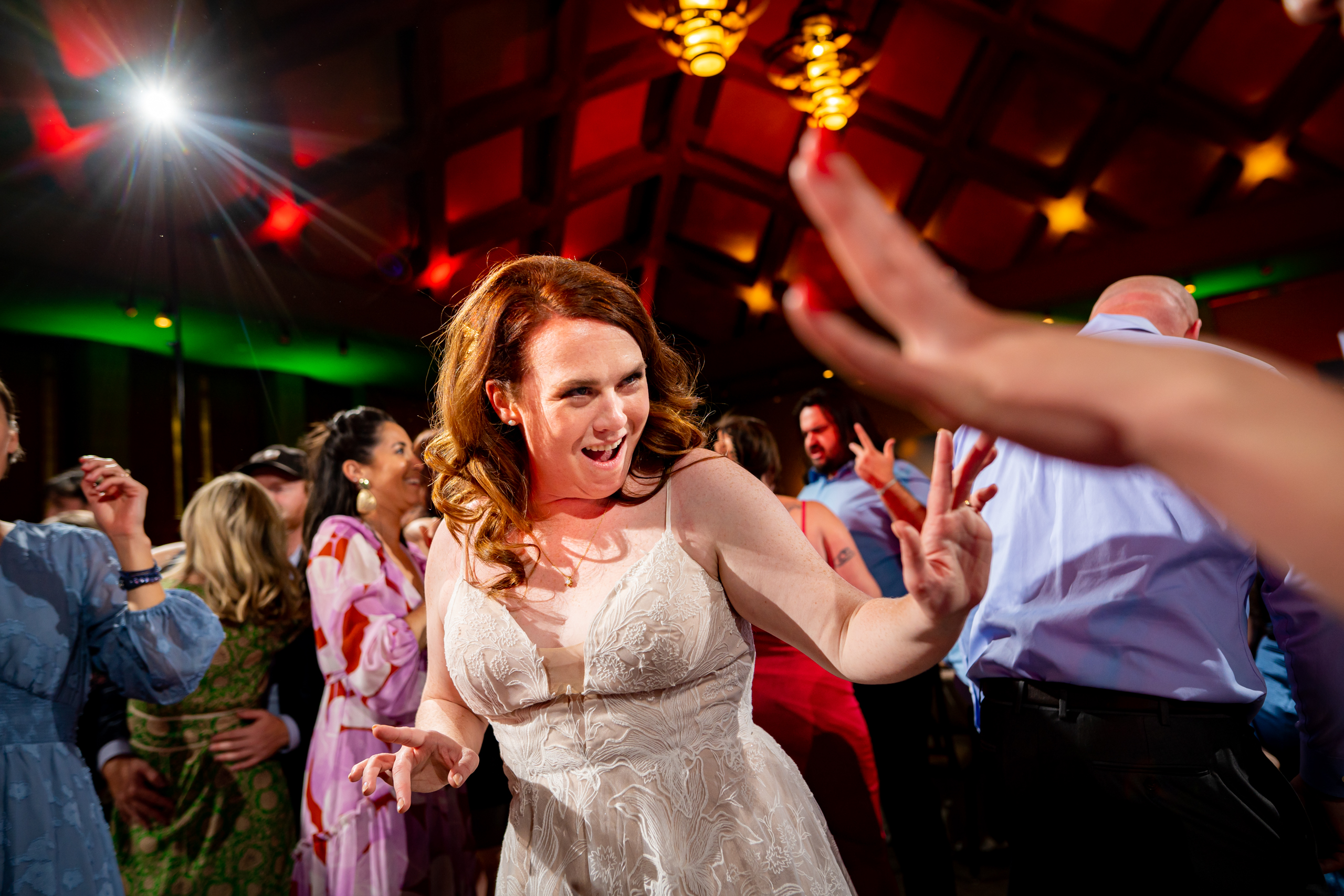 Guests dance to music on a colorful dance floor during the wedding reception, wedding photos, wedding photography, wedding photographer, wedding photo inspiration, Denver Botanic Garden wedding, Denver Botanic Garden wedding photos, Denver Botanic Garden wedding photography, Denver Botanic Garden wedding inspiration, Denver wedding venue, Denver wedding photos, Denver wedding photography, Denver wedding photographer, Colorado wedding photography