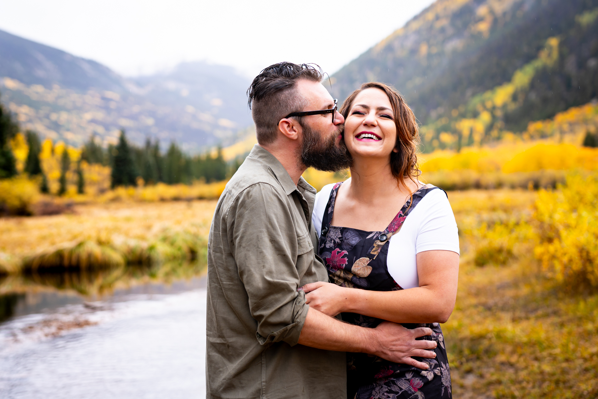 Cottonwood Pass Engagement Photos in Buena Vista with fall foliage, mountains and a winter blizzard