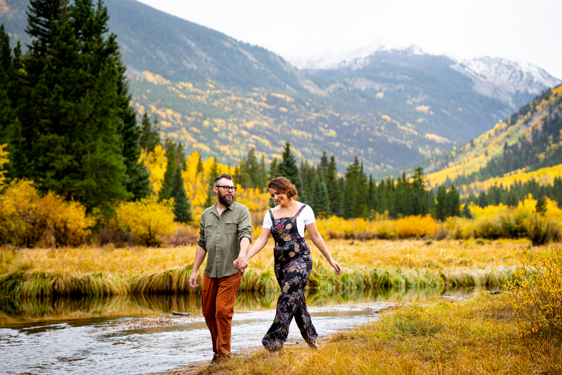 Cottonwood Pass Engagement Photos in Buena Vista with fall foliage, mountains and a winter blizzard