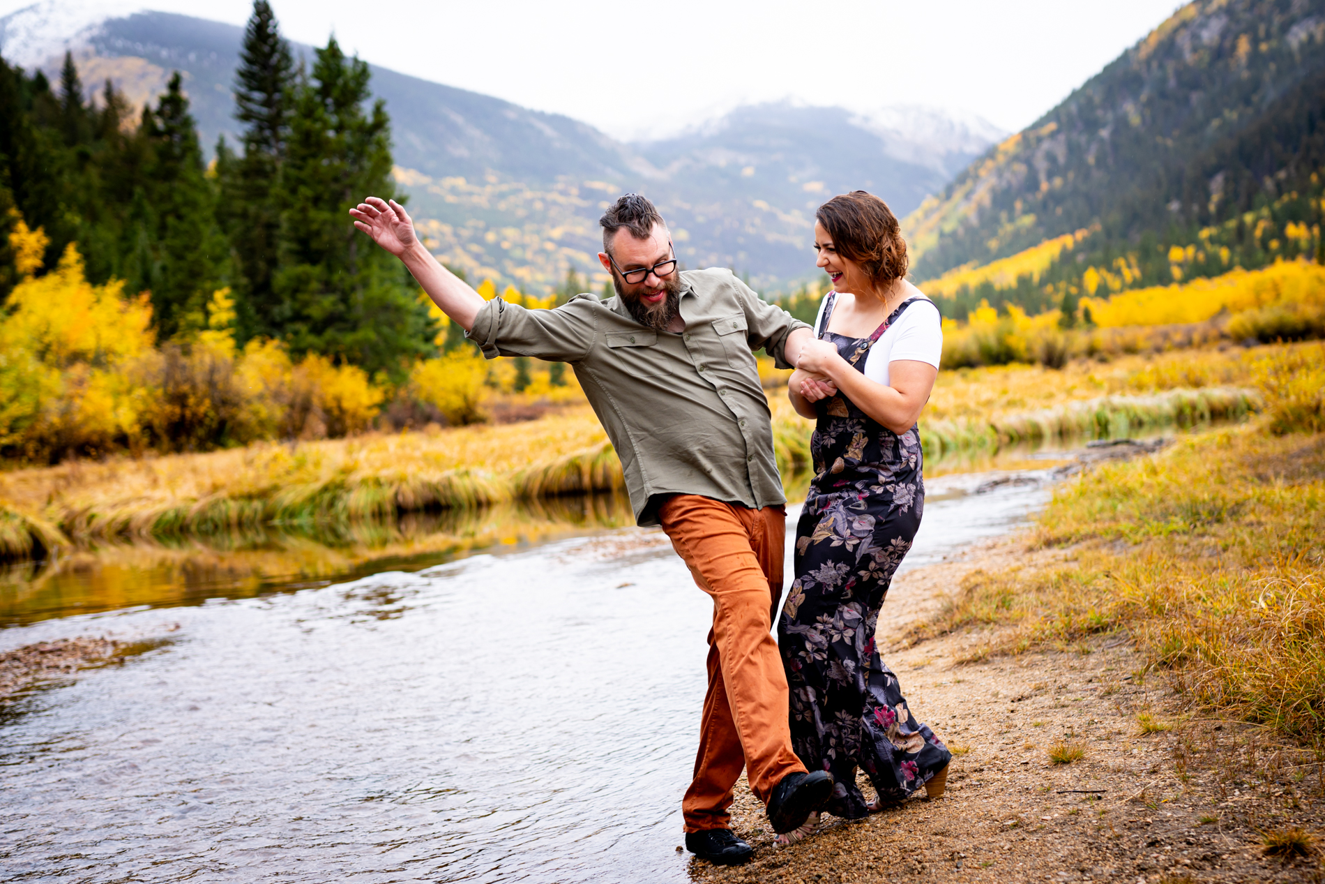 Cottonwood Pass Engagement Photos in Buena Vista with fall foliage, mountains and a winter blizzard